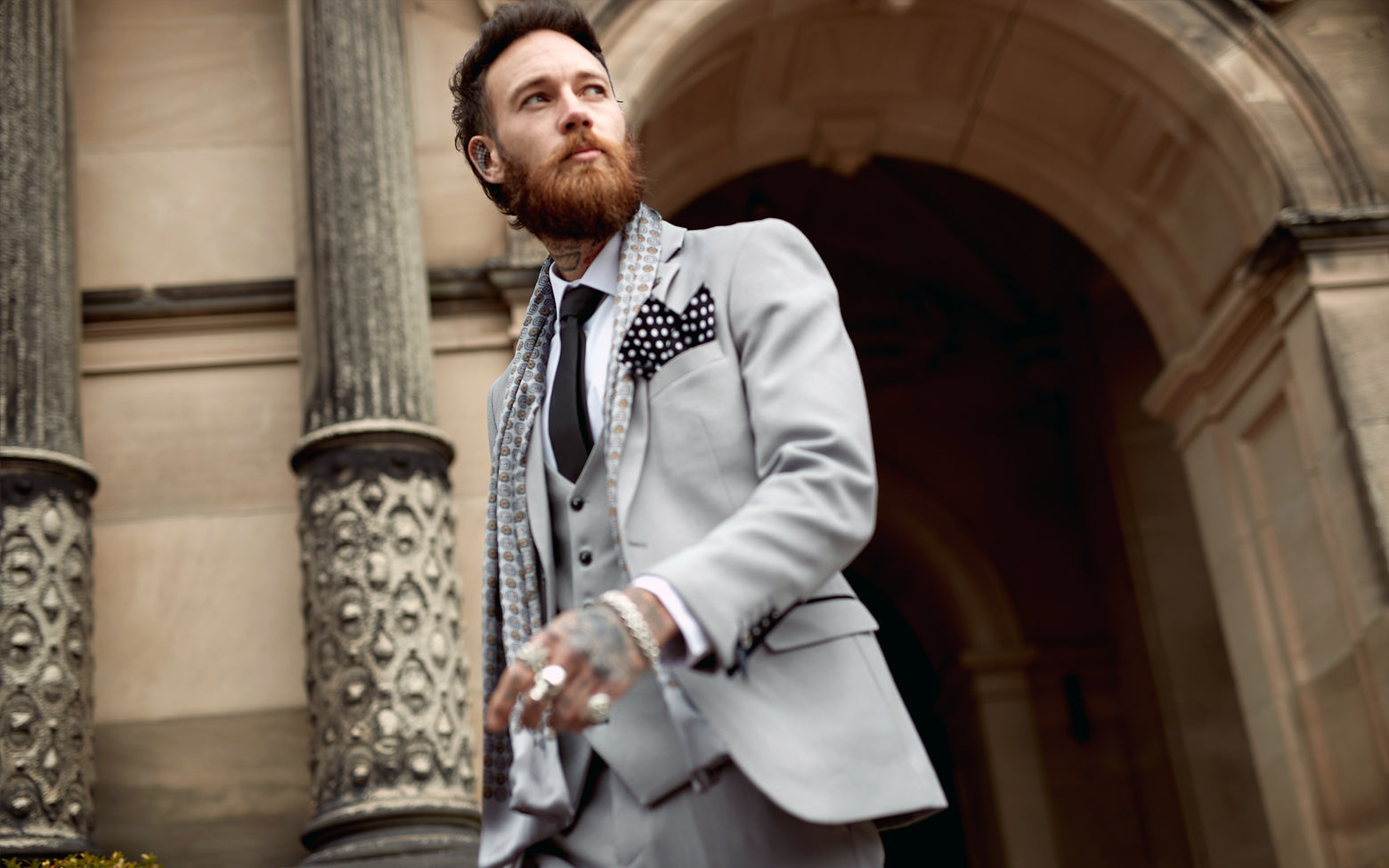 Do you wear a suit jacket under graduation gown? – Flex Suits