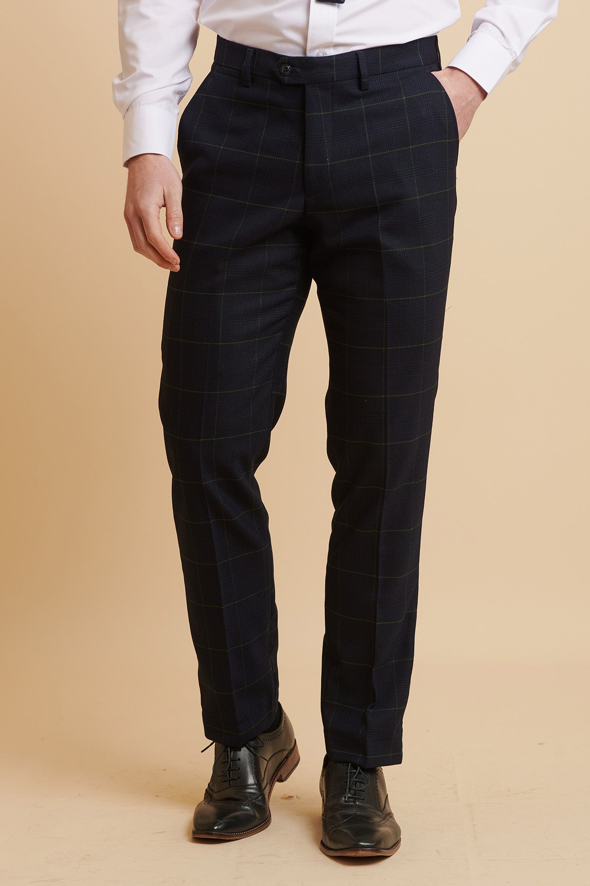 Someone dressed in Marc Darcy’s The Everton Collection Beto In EDINSON Navy Green Check Suit, paired with a white dress shirt and black dress shoes.