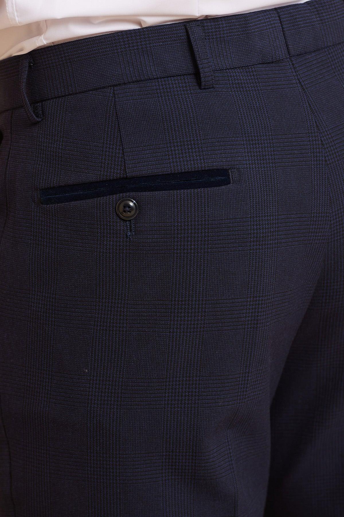Close-up of dark navy Prince of Wales check dress pants with a single black back pocket button, from the Marc Darcy WHU Collection—BROMLEY Navy Double Breasted Suit as worn by Jarrod Bowen.
