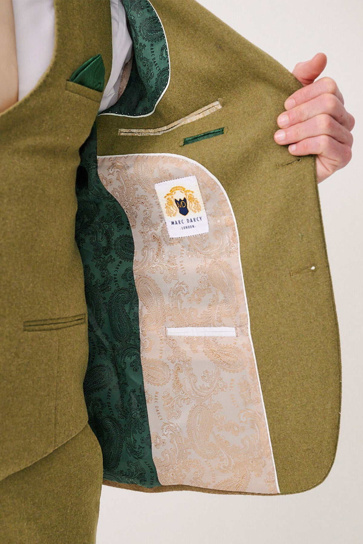 Close-up of the marcdarcy ARCHIE Moss Tweed Three Piece Suit jacket, with paisley lining and branded label inside—ideal for men’s formal wear.