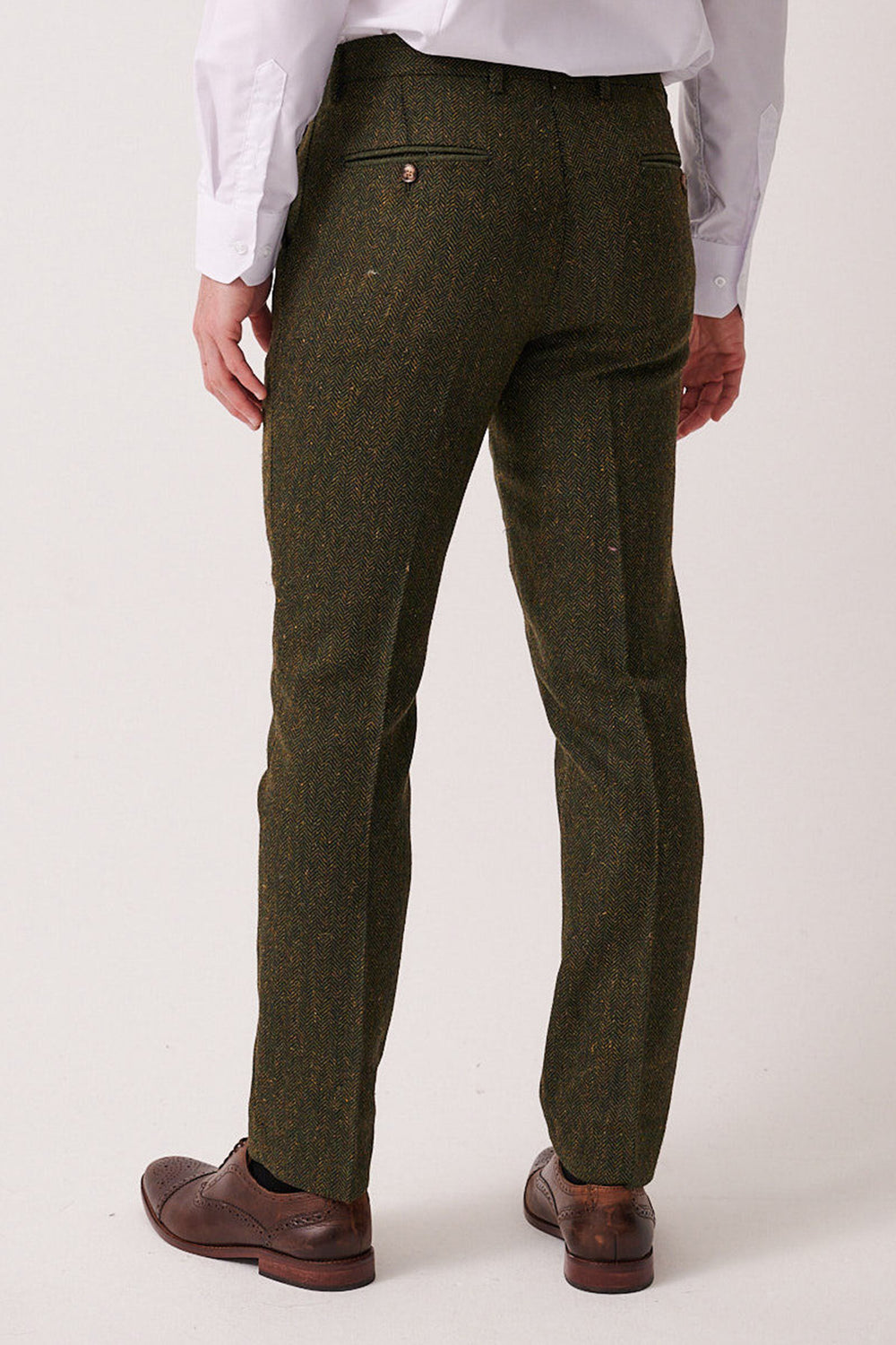 A person is seen from the back against a plain light background, wearing brown dress shoes, a white dress shirt, and marcdarcy DEAN - Olive Tweed Trousers.