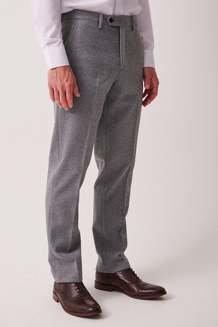 A man in the marcdarcy HAYDEN Silver Blue Crossweave Three Piece Suit stands against a plain light background. The classic slim fit look is highlighted, with the image cropped at the shoulders.