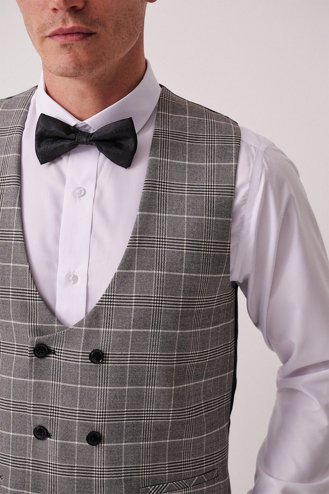 A man wears the marcdarcy DALTON Black Tux Lapel Suit with Ross Waistcoat—ideal for black tie events or styled under a slim fit blazer.