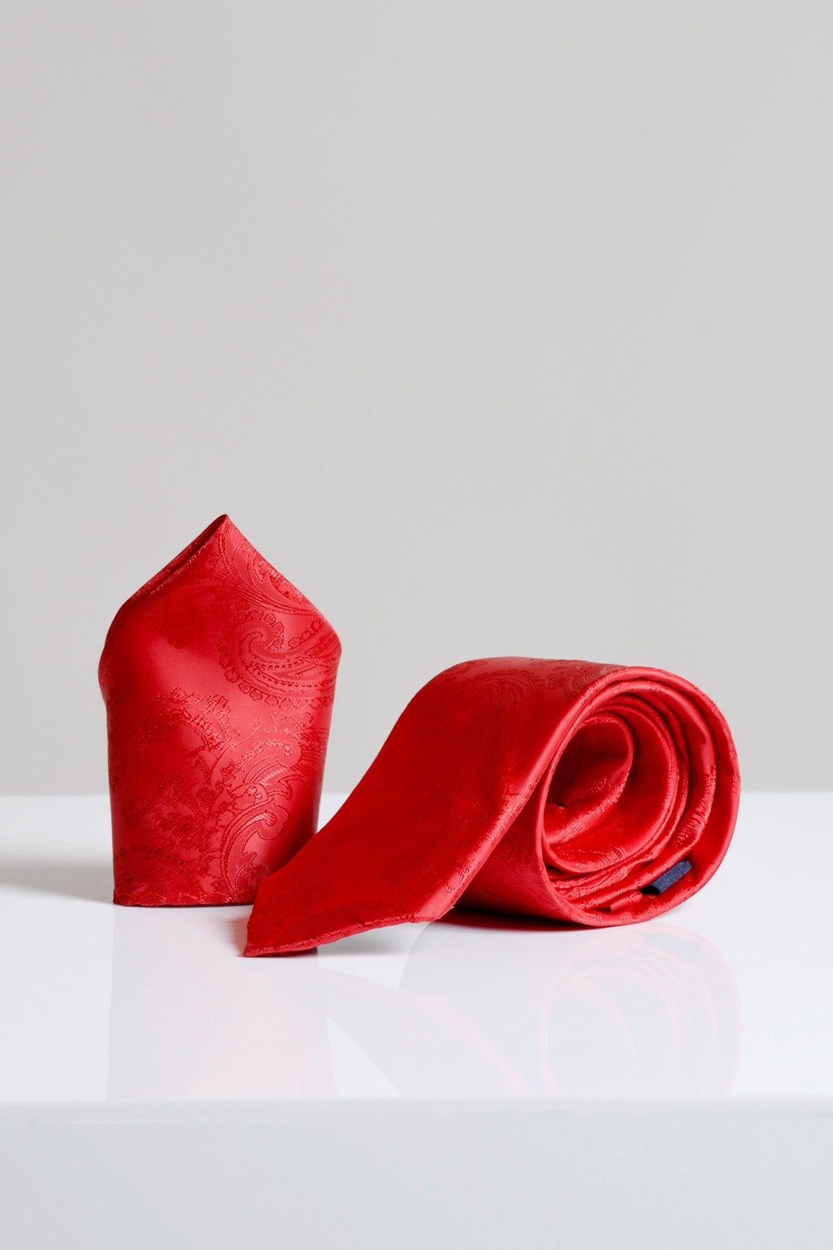 The MD PAISLEY - Red Paisley Tie and Pocket Square Set by Accessory is shown upright on a white surface with a plain light gray background.