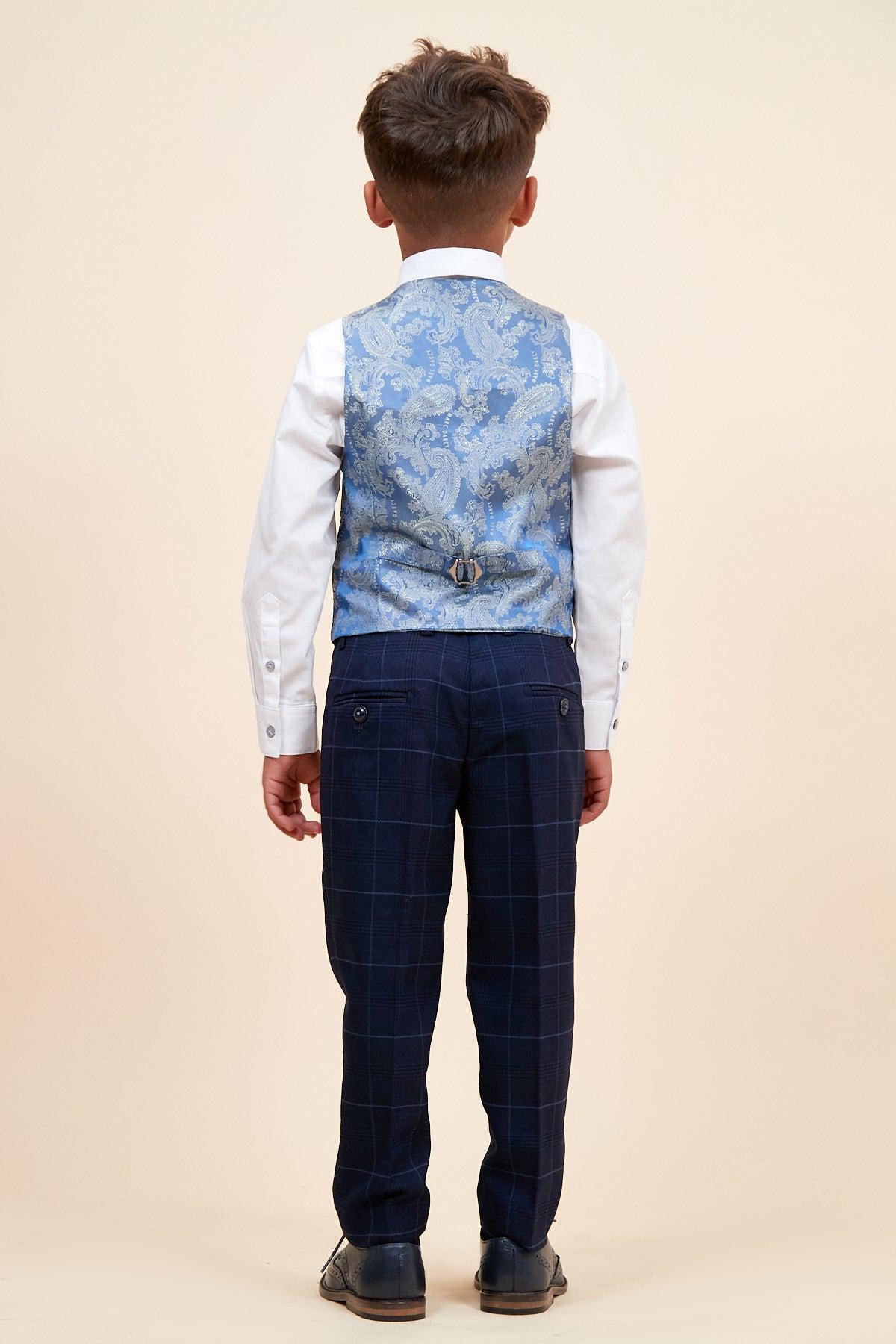 A young boy, seen from behind, wears the Marc Darcy EDINSON Children's Navy Sky Check Print Three Piece Suit against a plain beige background.