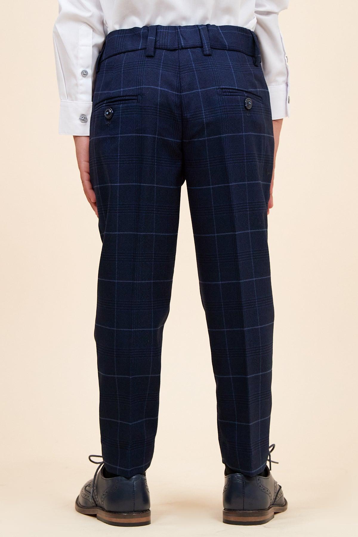 A child models the Marc Darcy EDINSON Children's Navy Sky Check Print Three Piece Suit from the back against a plain light background—ideal for weddings or any formal occasion.