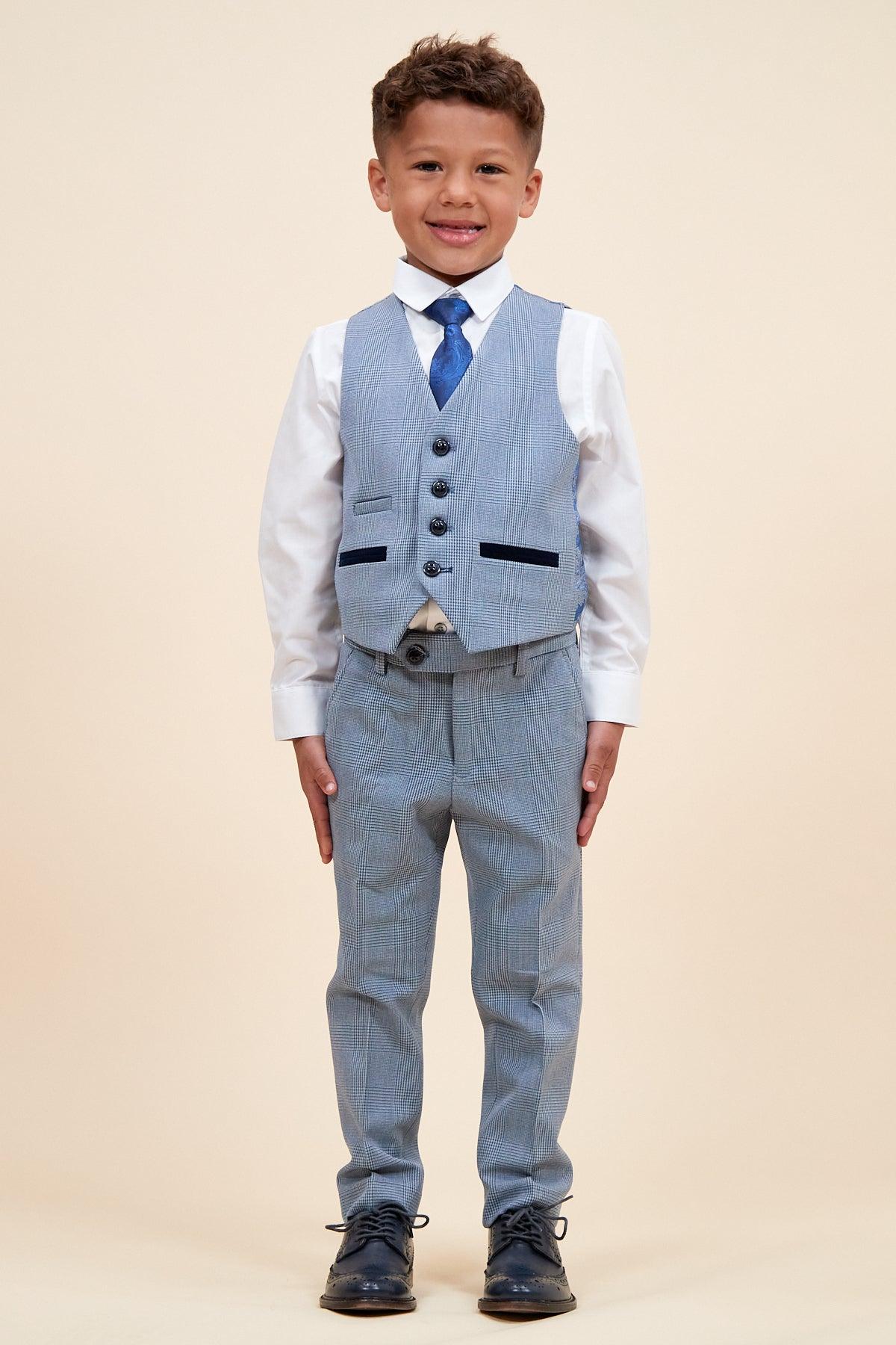 Young boy smiling in a Marc Darcy BROMLEY children's sky blue check print three piece suit with white shirt and blue tie.