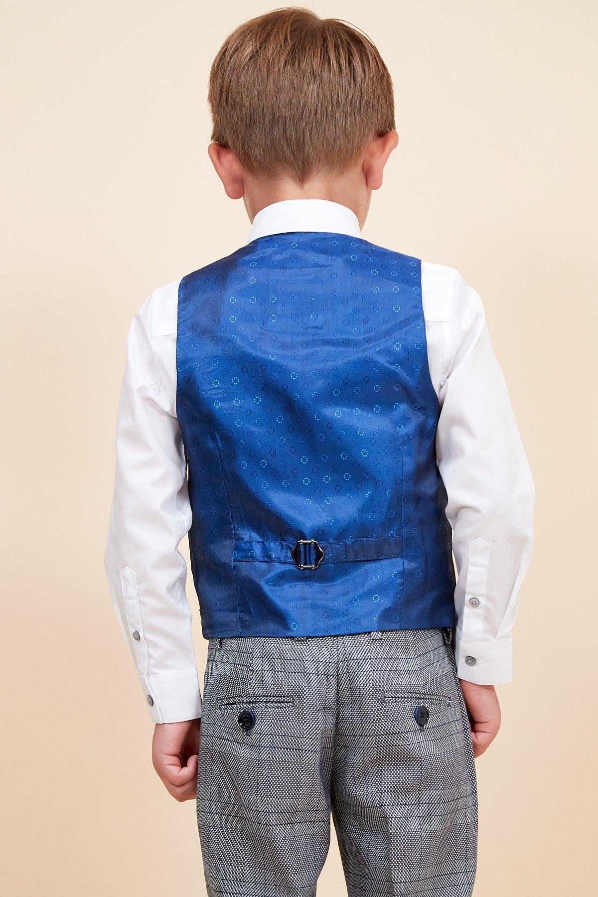 Back view of a boy wearing the marcdarcy JERRY - Children's Grey Check Three Piece Suit, featuring an adjustable waistband, white shirt, blue patterned vest, and grey check trousers.