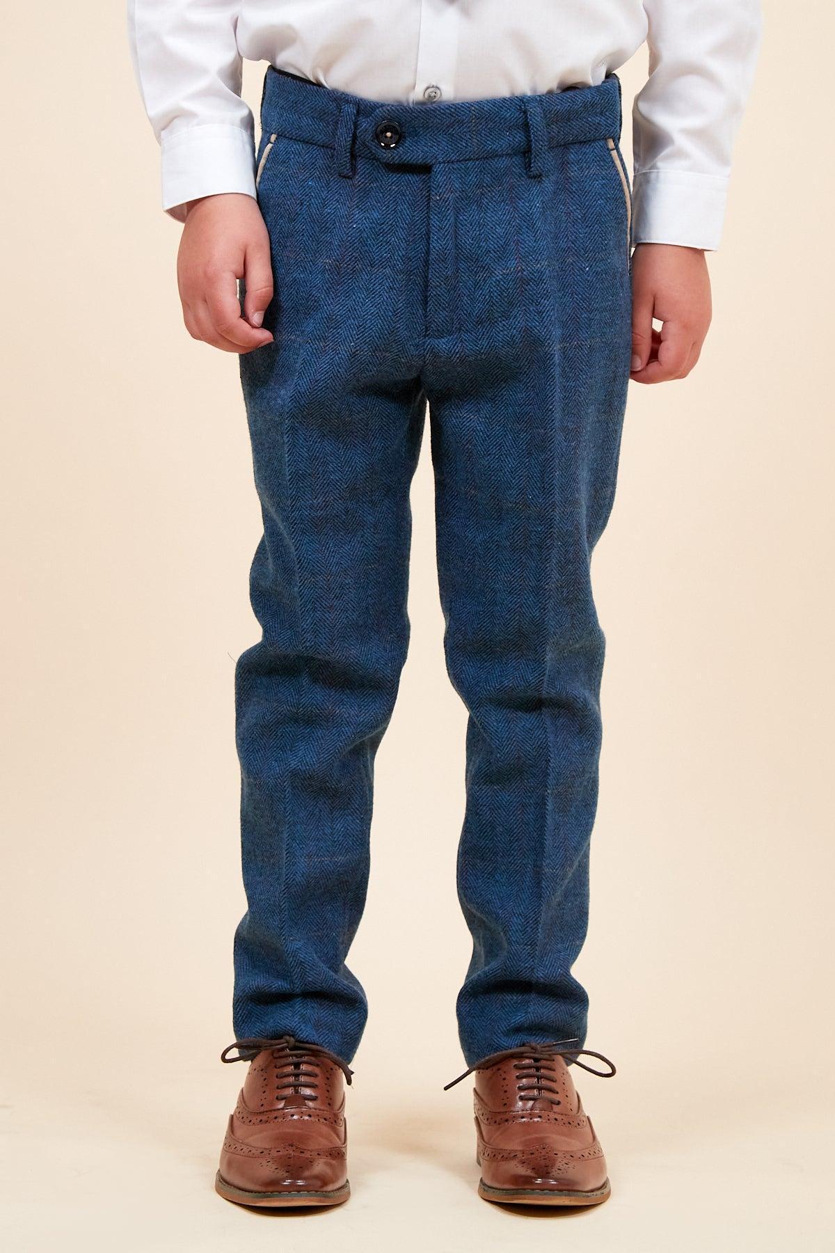 A young boy wearing the marcdarcy DION Children’s Blue Tweed Check Three Piece Suit stands against a plain light background. His face is not visible.