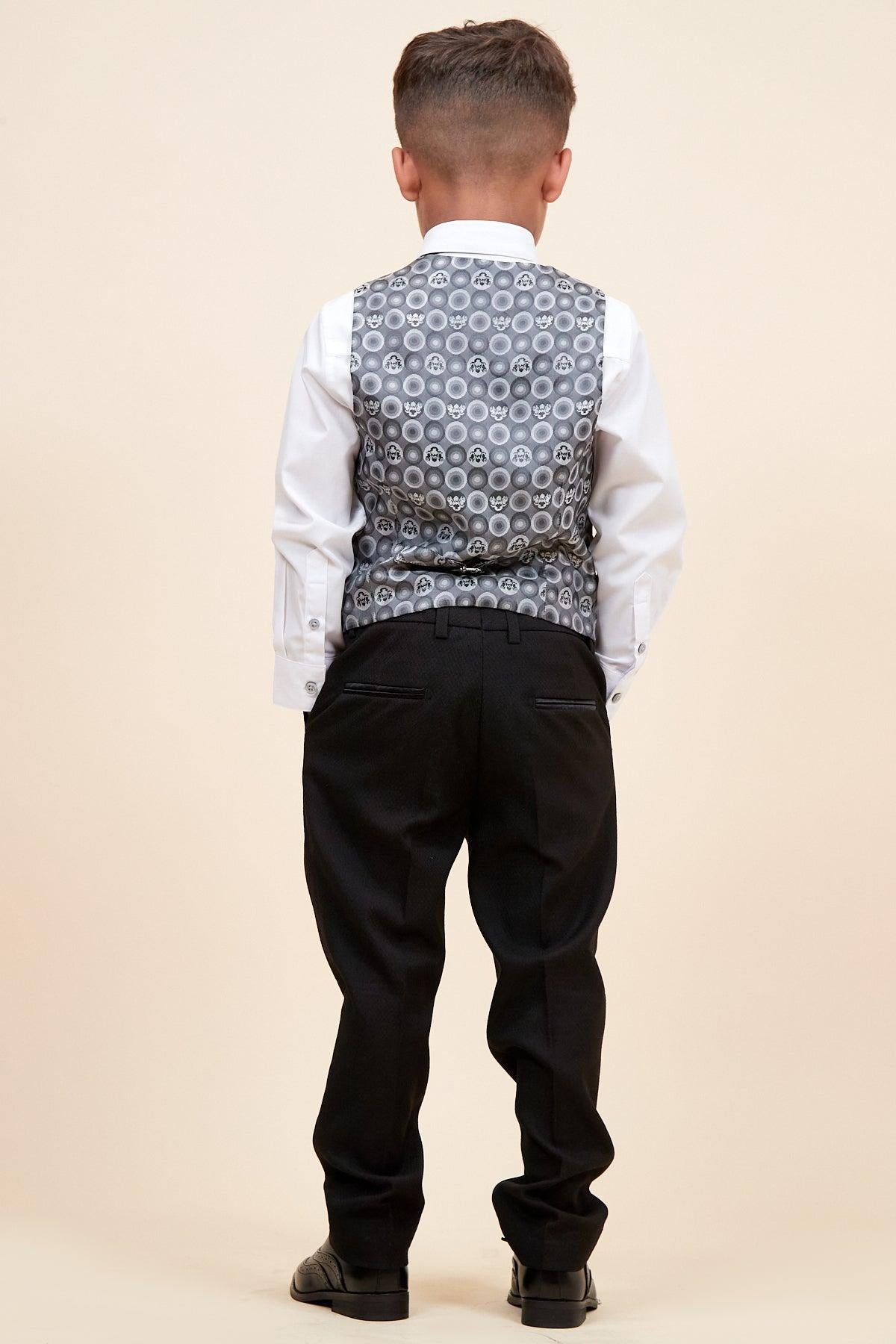 The DALTON - Children's Black Tux Lapel Diamond Three Piece Suit by marcdarcy features a white shirt, patterned grey vest, and black pants—ideal for any special occasion.