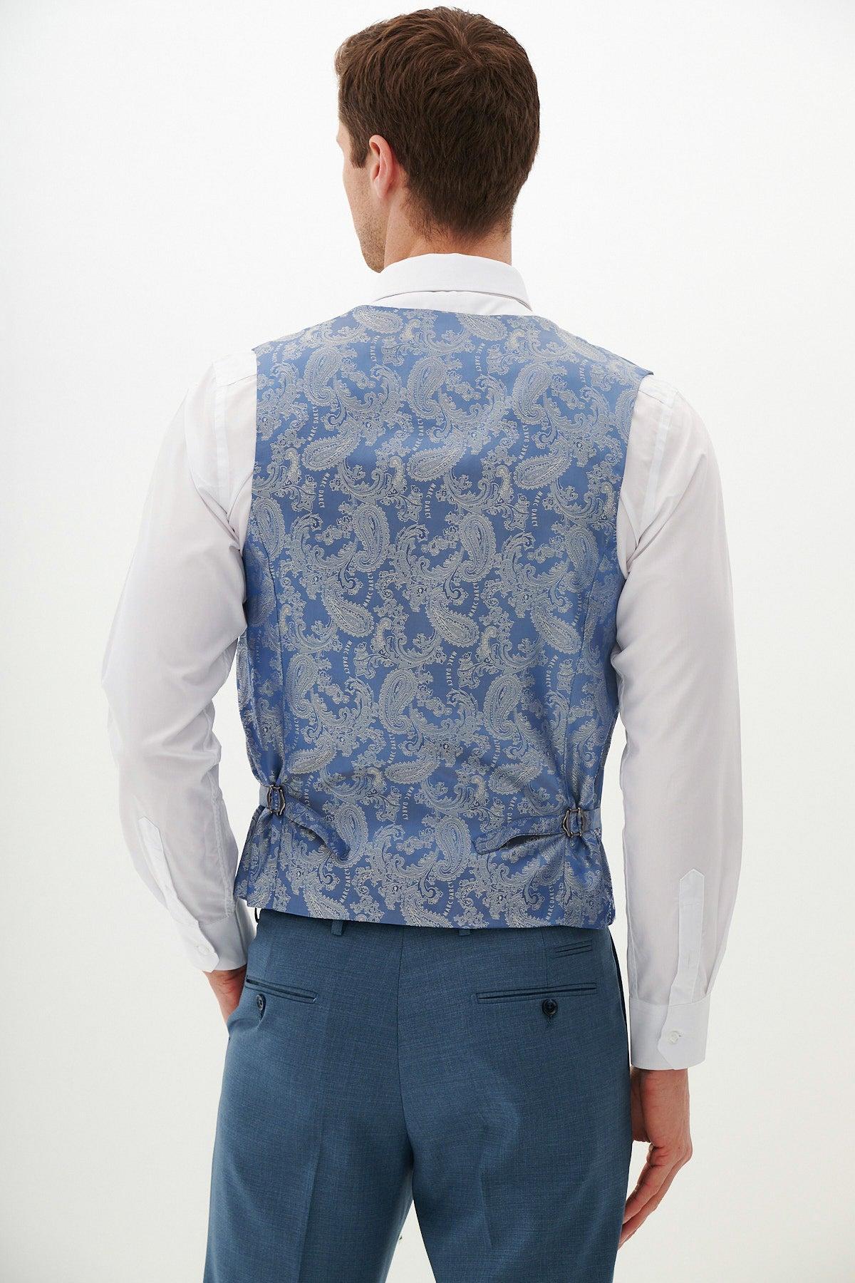 Back view of a man wearing the Marc Darcy FINLEY Teal Blue Single Breasted Waistcoat with a slim fit white dress shirt and blue suit trousers—perfect for summer formalwear.