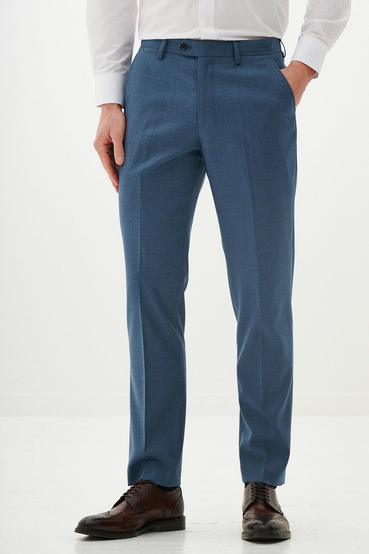 A person wears the Marc Darcy FINLEY Teal Blue Tailored Trousers with a white dress shirt and brown leather shoes against a white background—an essential look for any summer wardrobe.