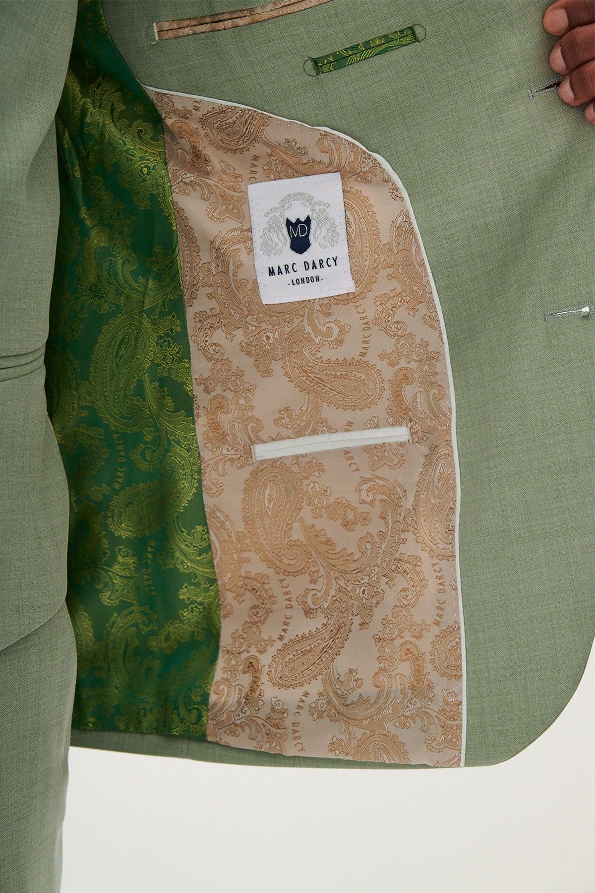 Close-up of the Marc Darcy FINLEY Moss Green Two Piece Suit interior, ideal for summer weddings. Lined with green paisley on one side and tan paisley with the Marc Darcy logo on the other.