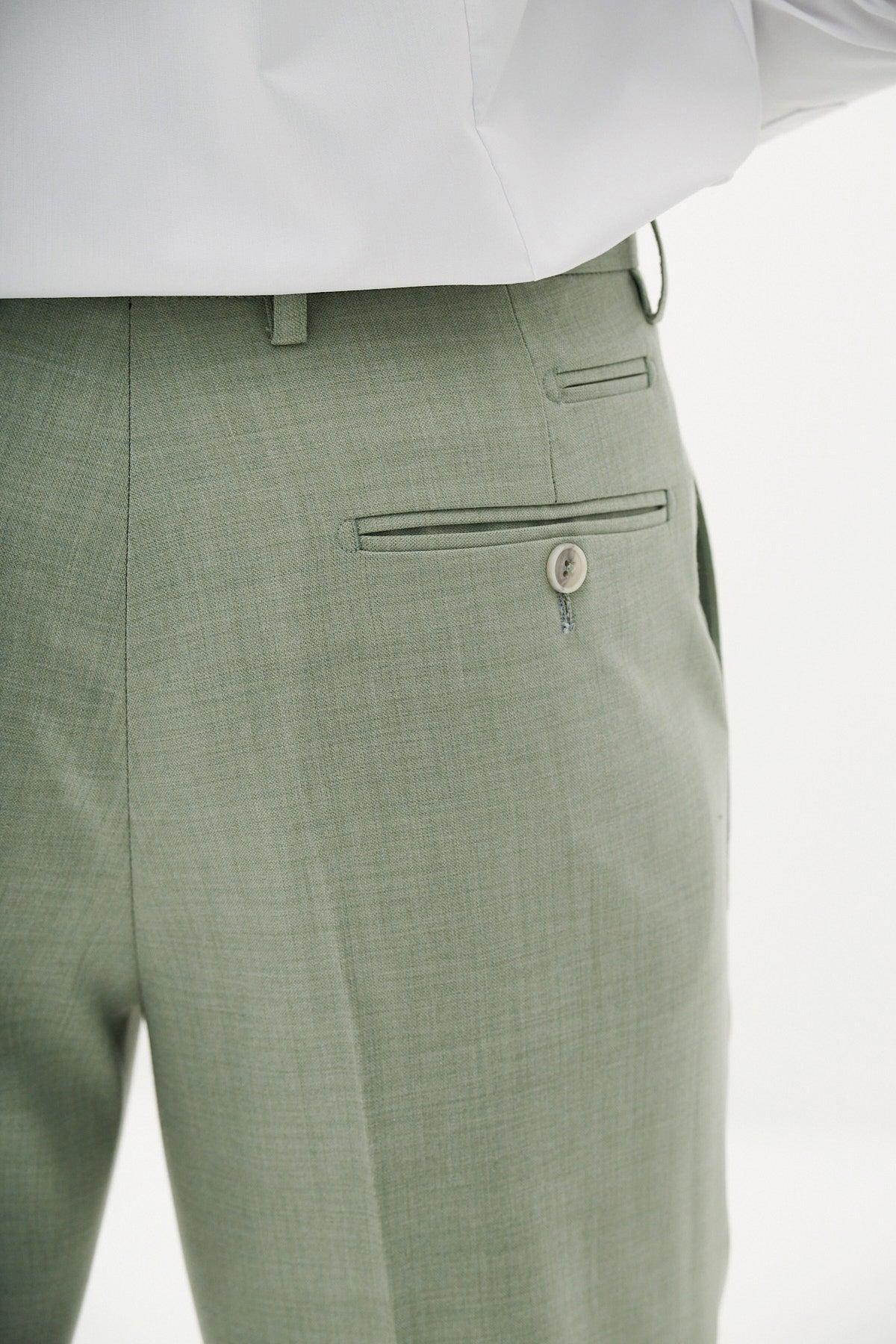 A close-up of the back pocket and waistband of the FINLEY - Moss Green Three Piece Suit by Marc Darcy, ideal for summer weddings or as part of a stylish three-piece ensemble.