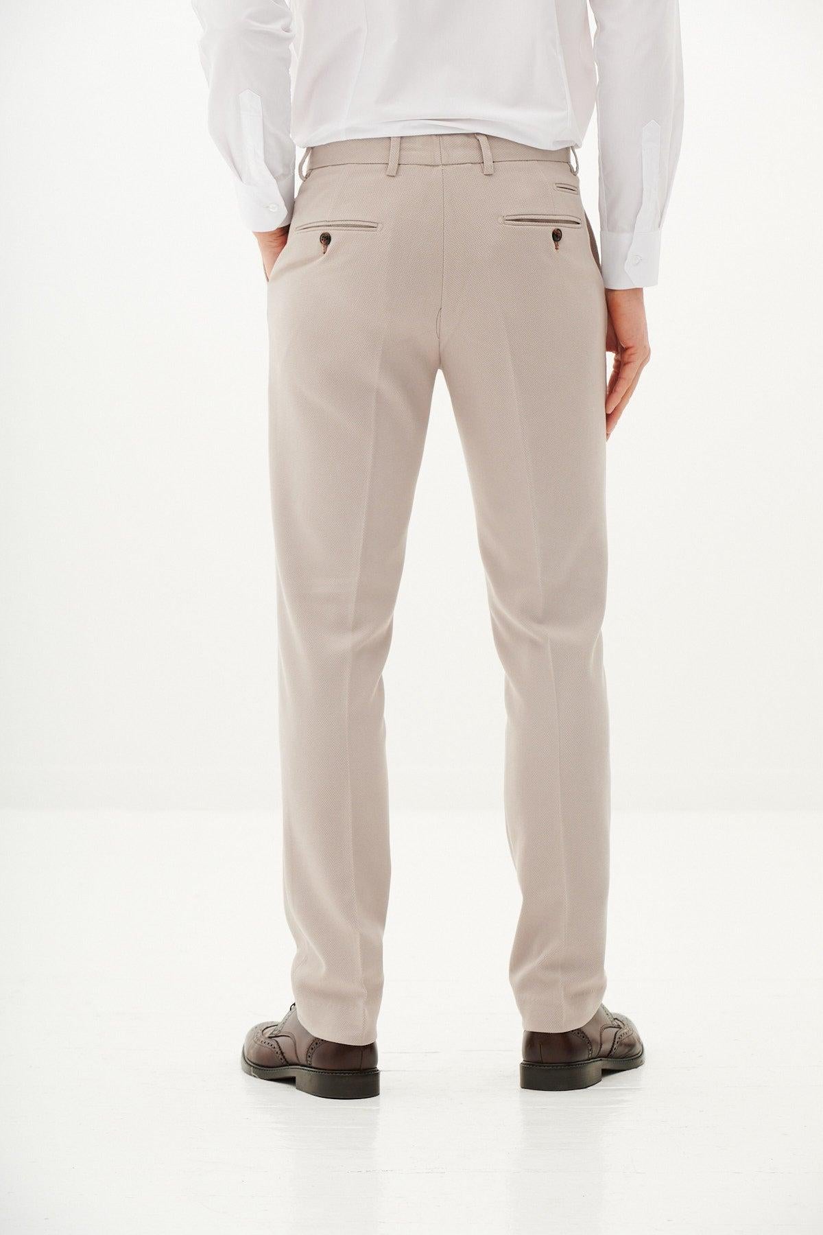 A man, back view, wears the Marc Darcy HM5 - Tan Blazer with HM5 Stone Waistcoat & Trousers for a refined, slim-fit silhouette.