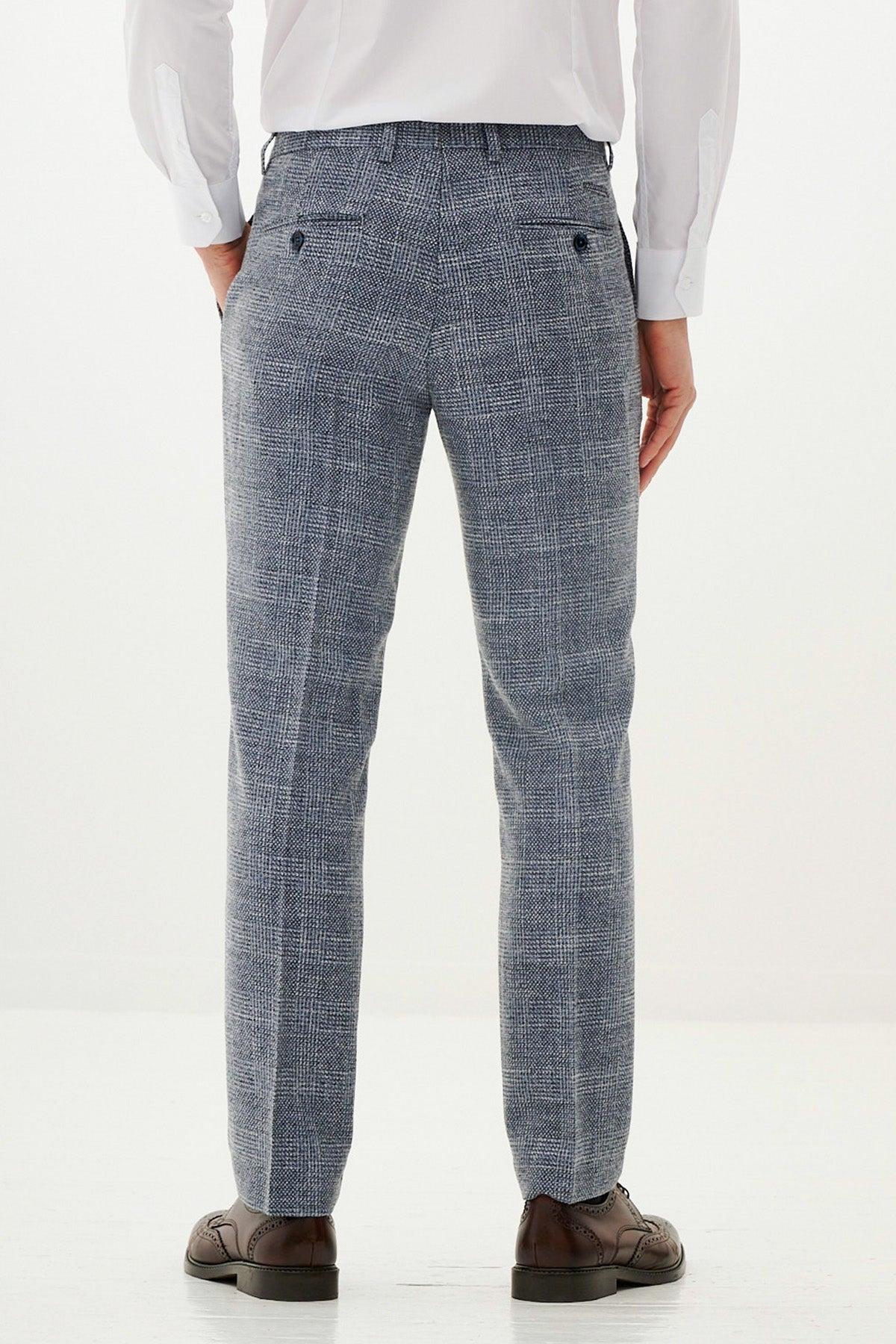 Man wearing the marcdarcy KRIS sky blue tweed suit paired with a Kelvin navy waistcoat, styled in classic Marc Darcy fashion.