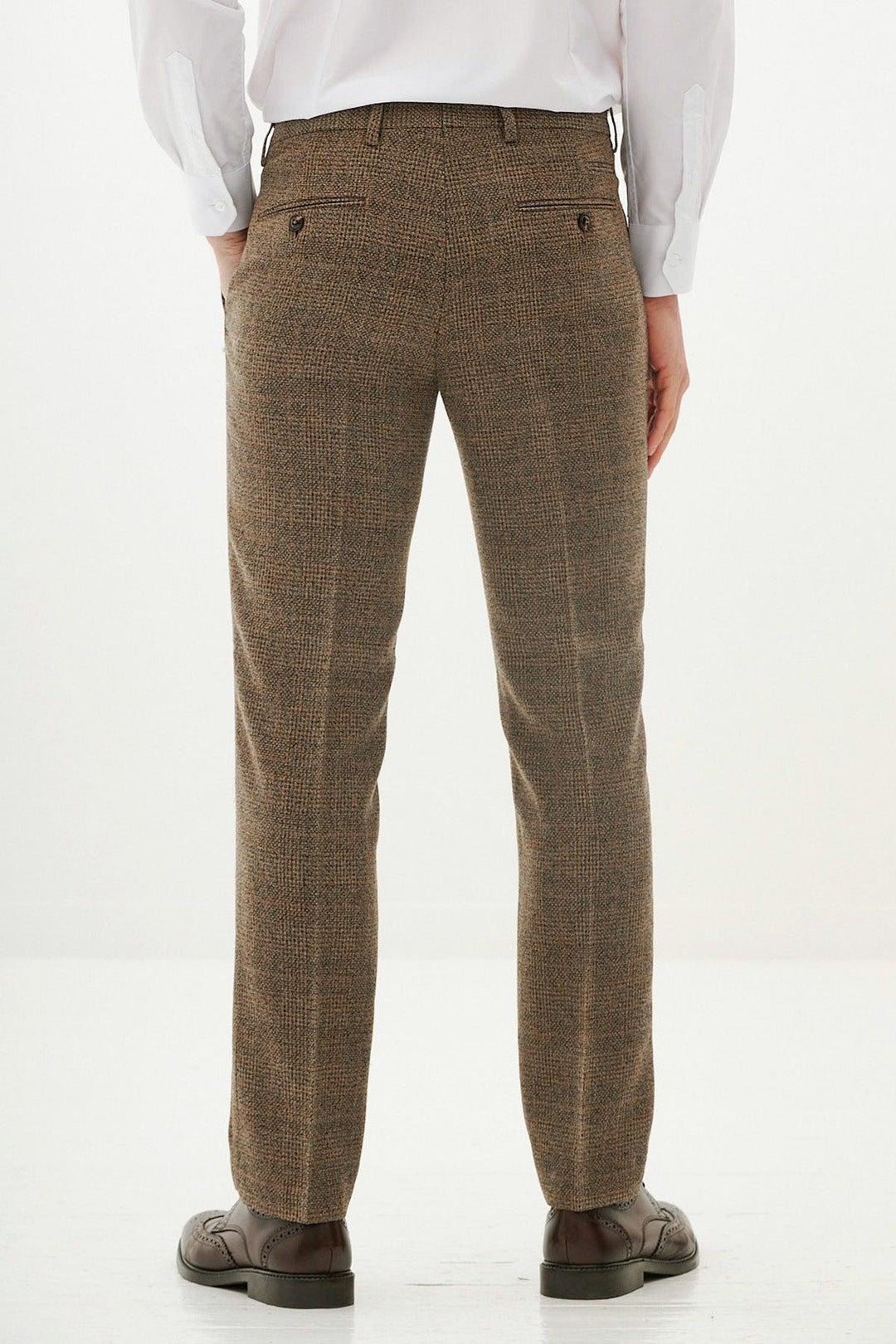 A person is seen from the back wearing the marcdarcy KRIS Tan Tweed Three Piece Suit, featuring slim fit trousers, against a plain light background.