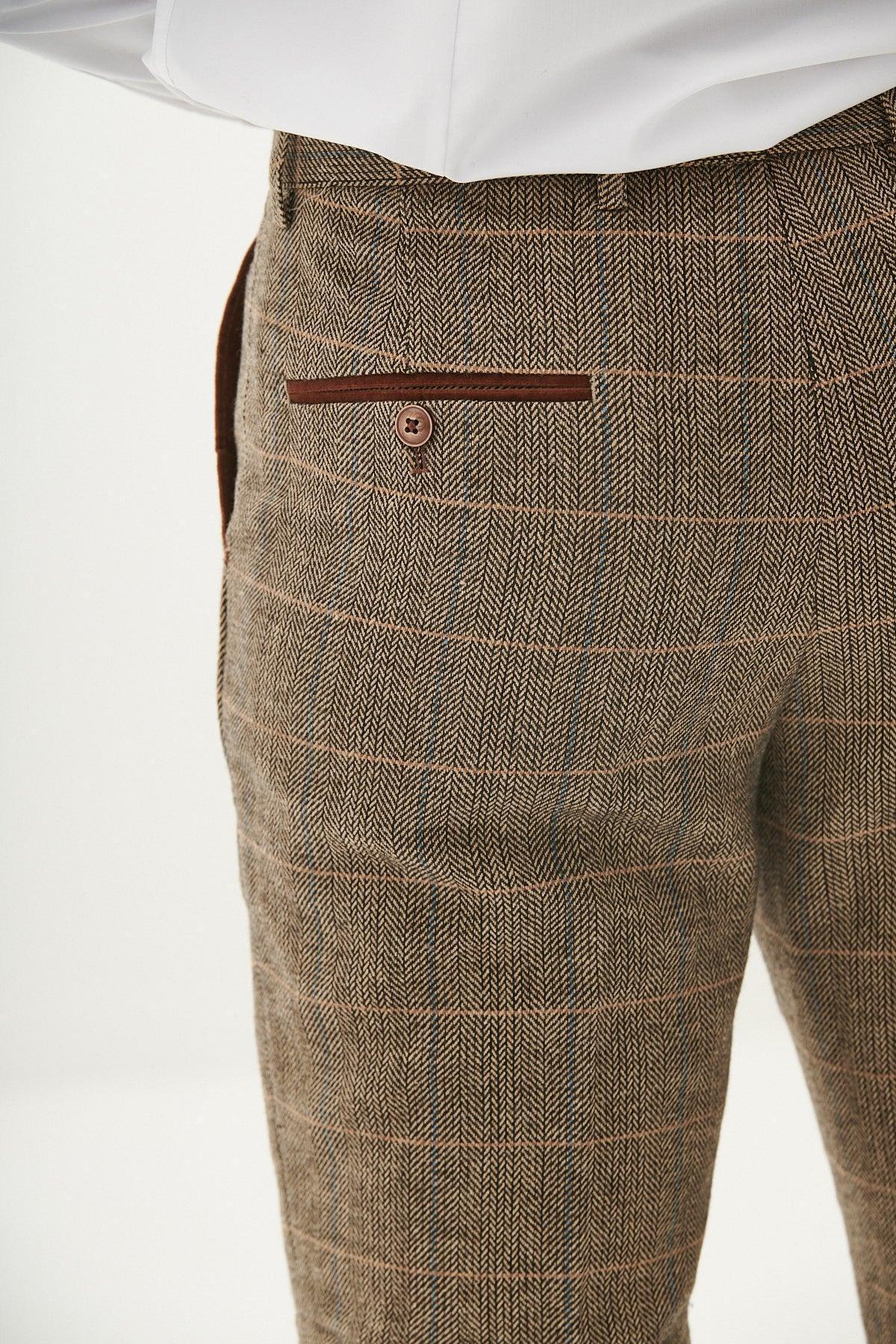 Close-up of marcdarcy’s TED - Tan Tweed Check Trousers with a subtle plaid pattern, single back pocket with brown trim and button—ideal for a refined country barn wedding.