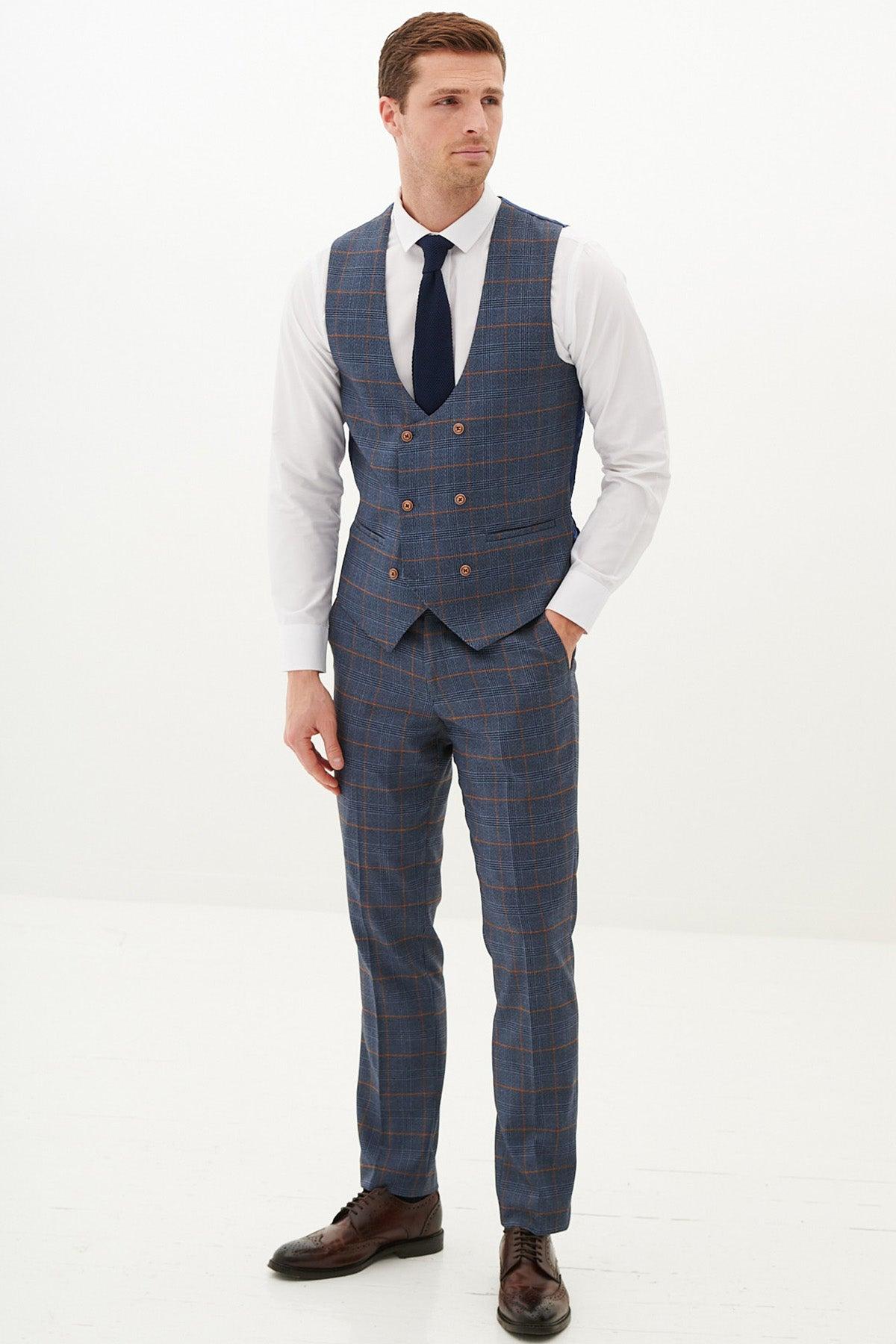 Man in a marcdarcy JENSON sky blue check suit with double breasted waistcoat, white dress shirt, and navy tie—ideal men's workwear.