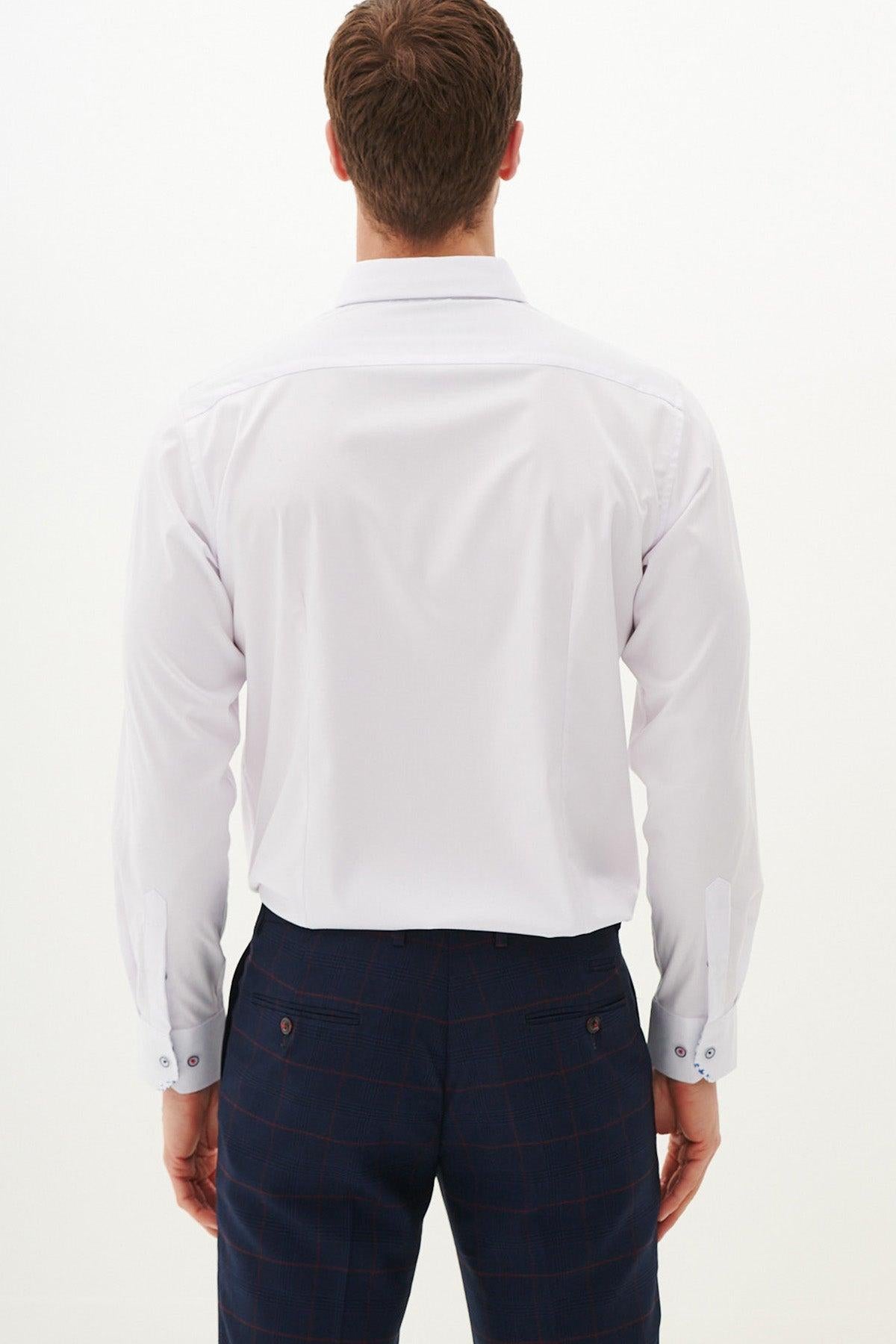 A man faces away from the camera, wearing the Marc Darcy LUKE white long sleeve shirt and dark blue plaid trousers, set against a plain white background.