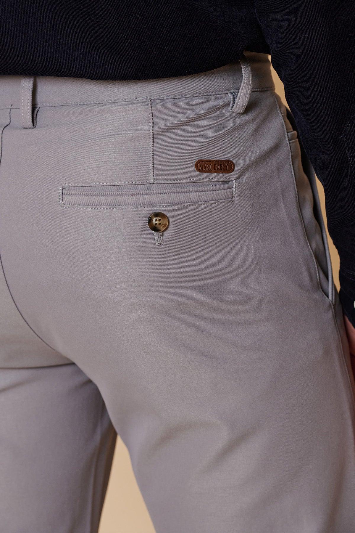 A close-up of the back pocket of the ENZO - Mid Grey Chinos by marcdarcy shows a brown leather label above the pocket, highlighting the smart-casual style of these men's trousers.