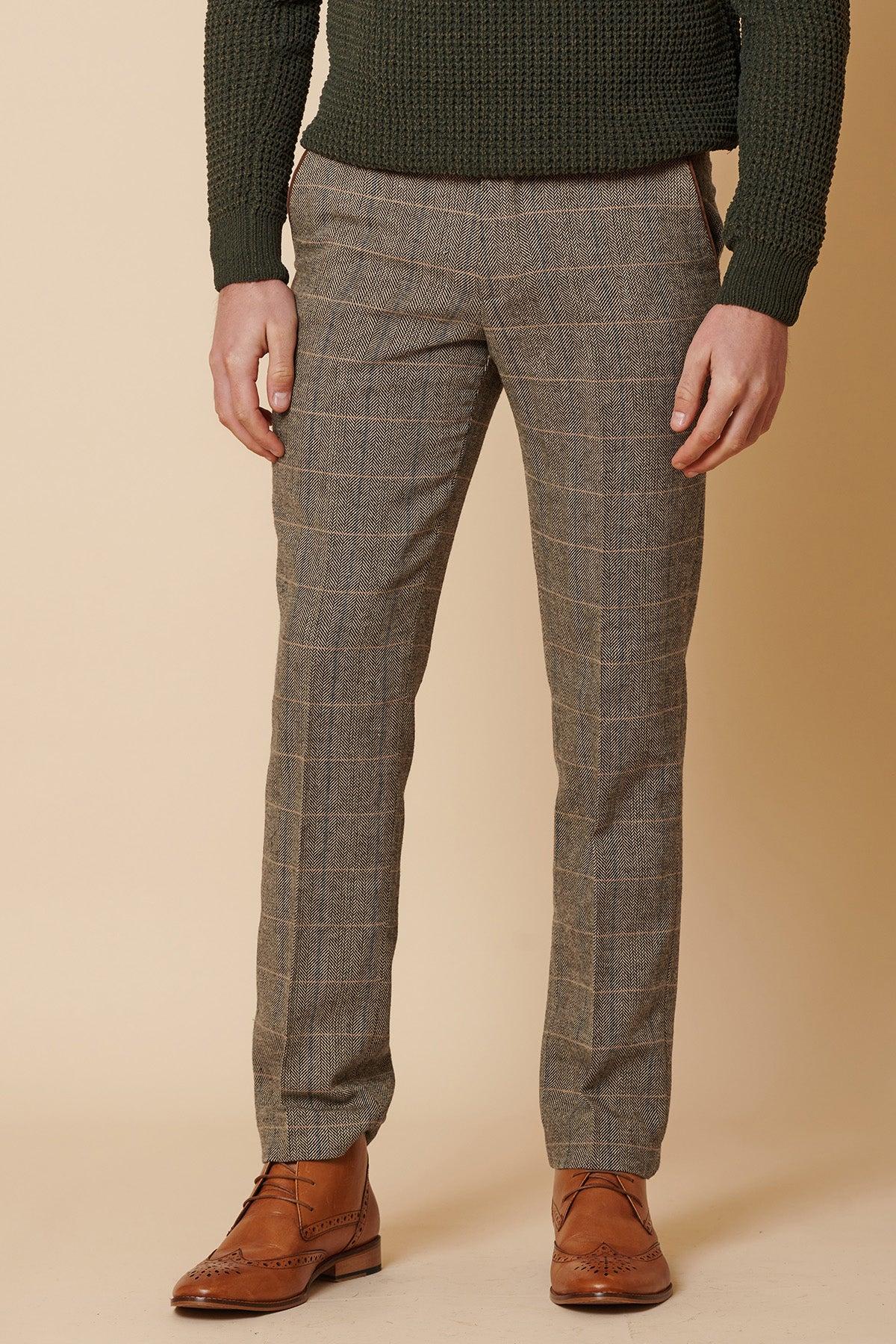 A man showcases English heritage style in the marcdarcy DX7 Tan Tweed Check Two Piece Suit, pairing classic tailoring with timeless sophistication.