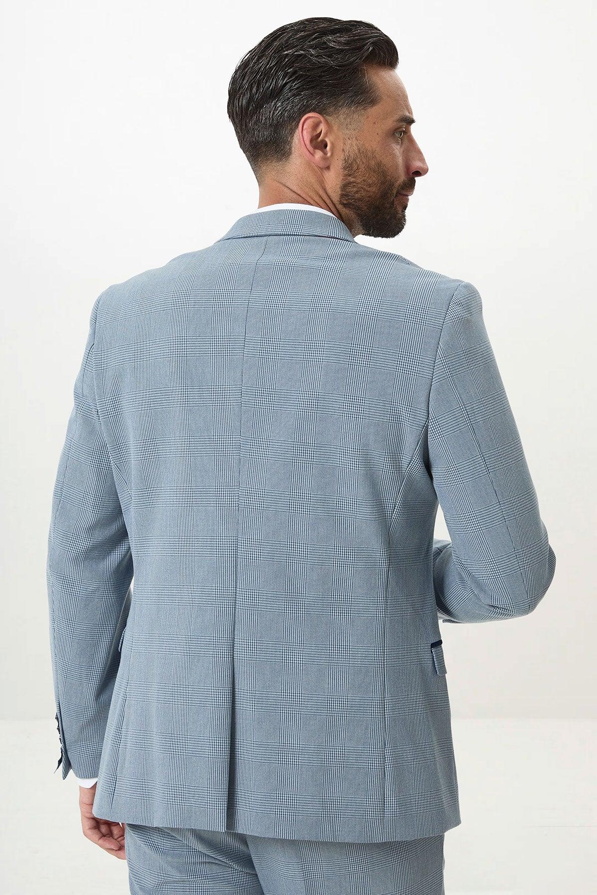 A man with dark hair and a beard is shown from behind, wearing the Marc Darcy BROMLEY Sky Check Suit with Kelvin Royal Waistcoat, standing against a plain white background.