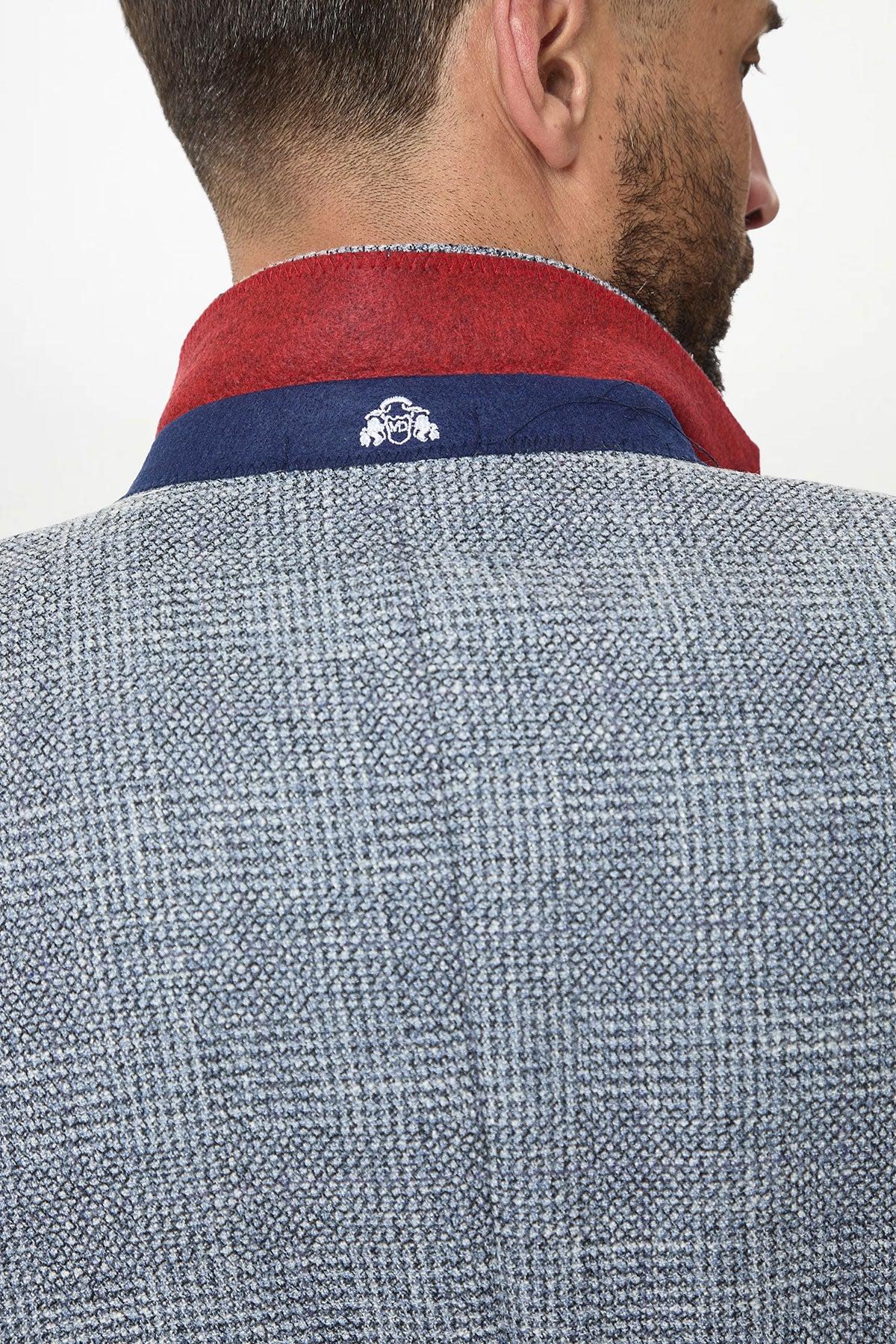 A man is seen from behind wearing the marcdarcy KRIS Sky Blue Tweed Two Piece Suit. His short dark hair and trimmed beard are partially visible.
