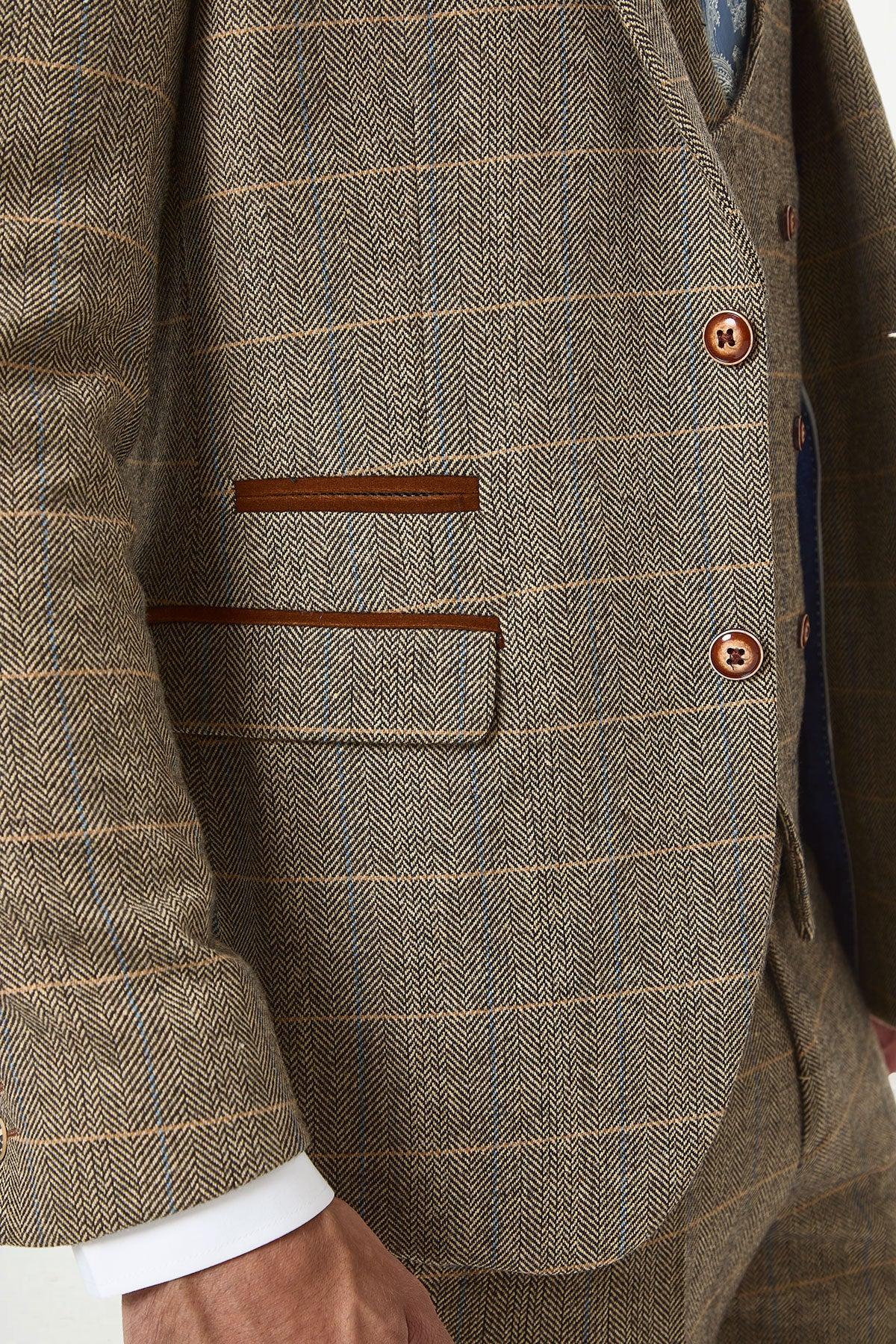 Close-up of marcdarcy’s DX7 Tan Tweed Check Three Piece Suit with Double Breasted Waistcoat, featuring a slim fit, subtle blue and tan checks, leather-trimmed pockets, and brown buttons—ideal for a rustic countryside wedding.