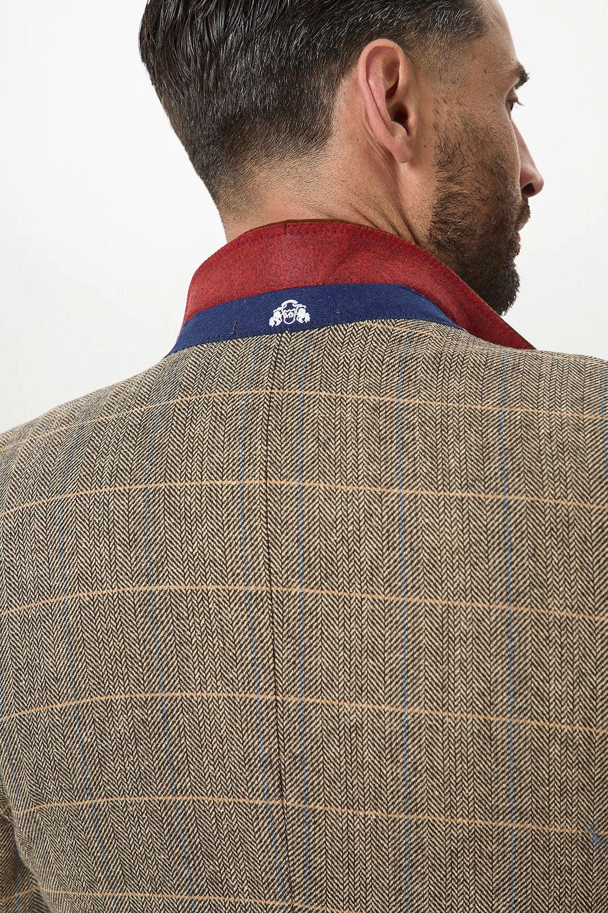 Back view of a man in the marcdarcy DX7—Tan Tweed Check Three Piece Suit with Double Breasted Waistcoat—ideal for rustic countryside weddings.