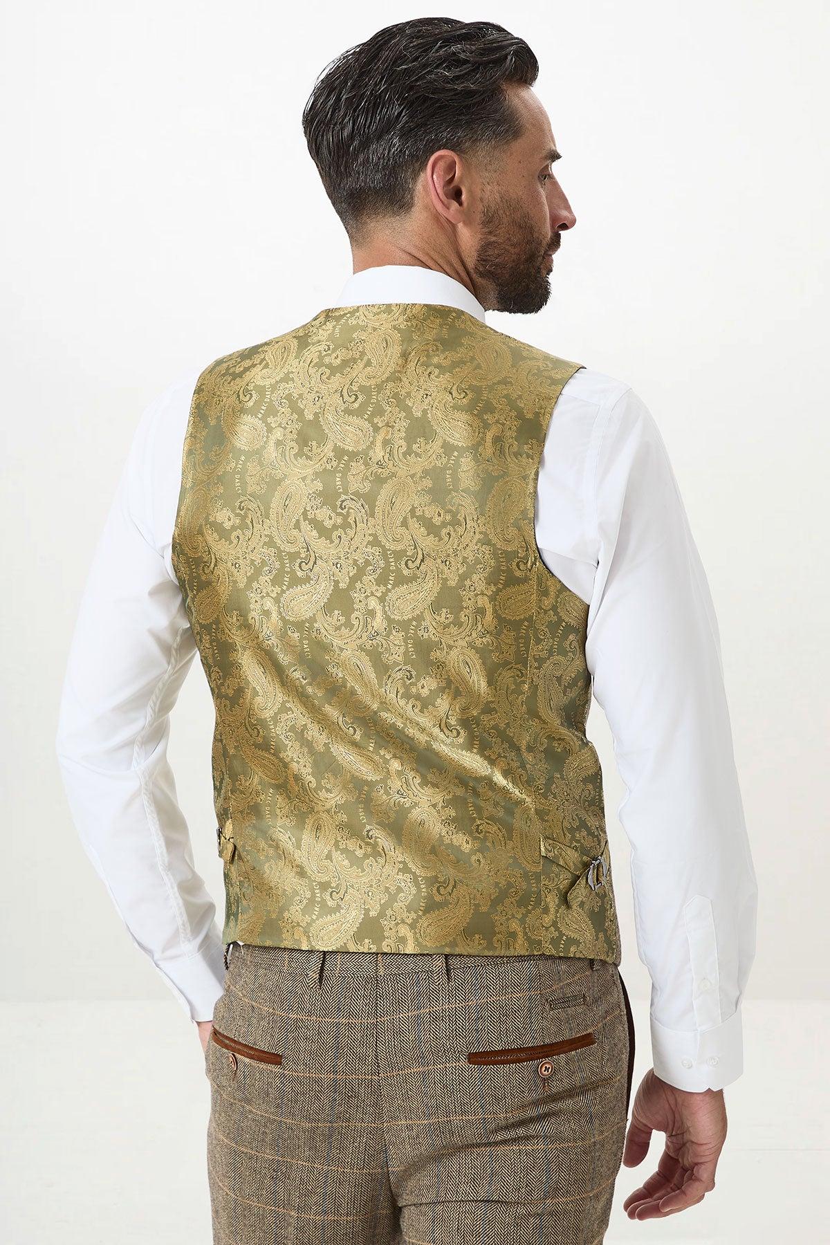 A man with dark hair and a beard, seen from behind against a plain background, wears the marcdarcy DX7 Tan Tweed Check Three Piece Suit featuring brown plaid trousers and a double-breasted waistcoat.