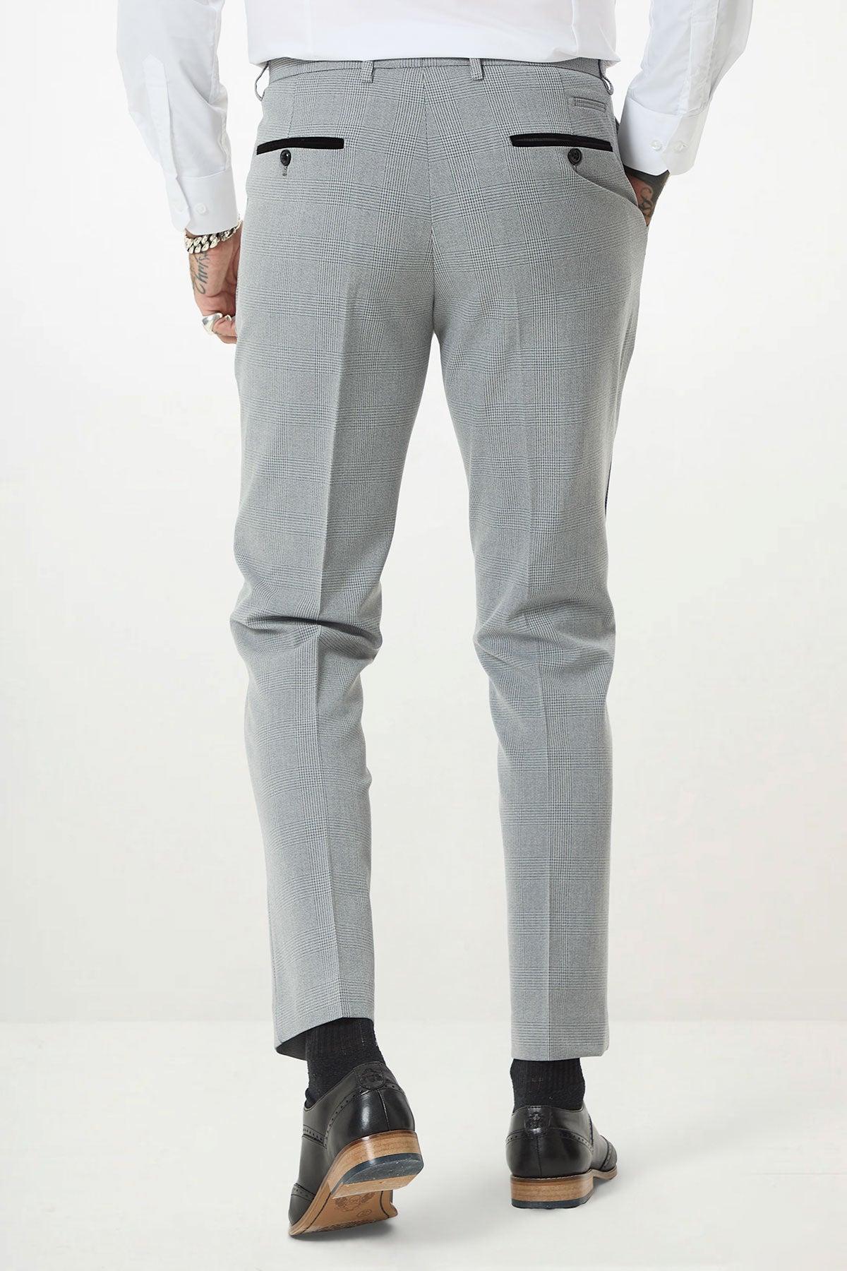 A man wearing the Marc Darcy BROMLEY - Silver Grey Check Three Piece Suit is seen from the back against a plain white background.