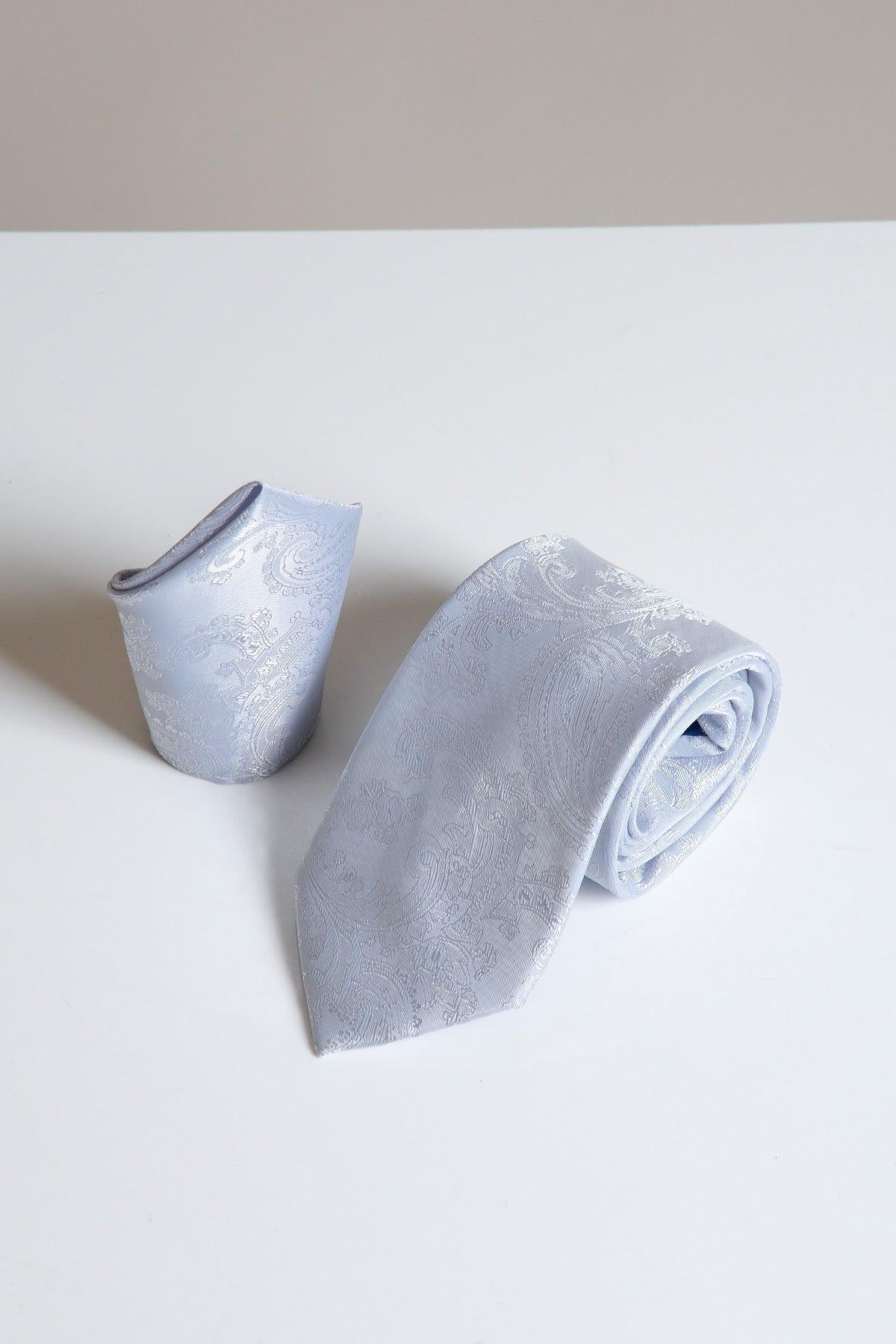 The MD PAISLEY Silver Paisley Tie and Pocket Square Set by Accessory, featuring a patterned tie and matching pocket square, is displayed on a white surface.