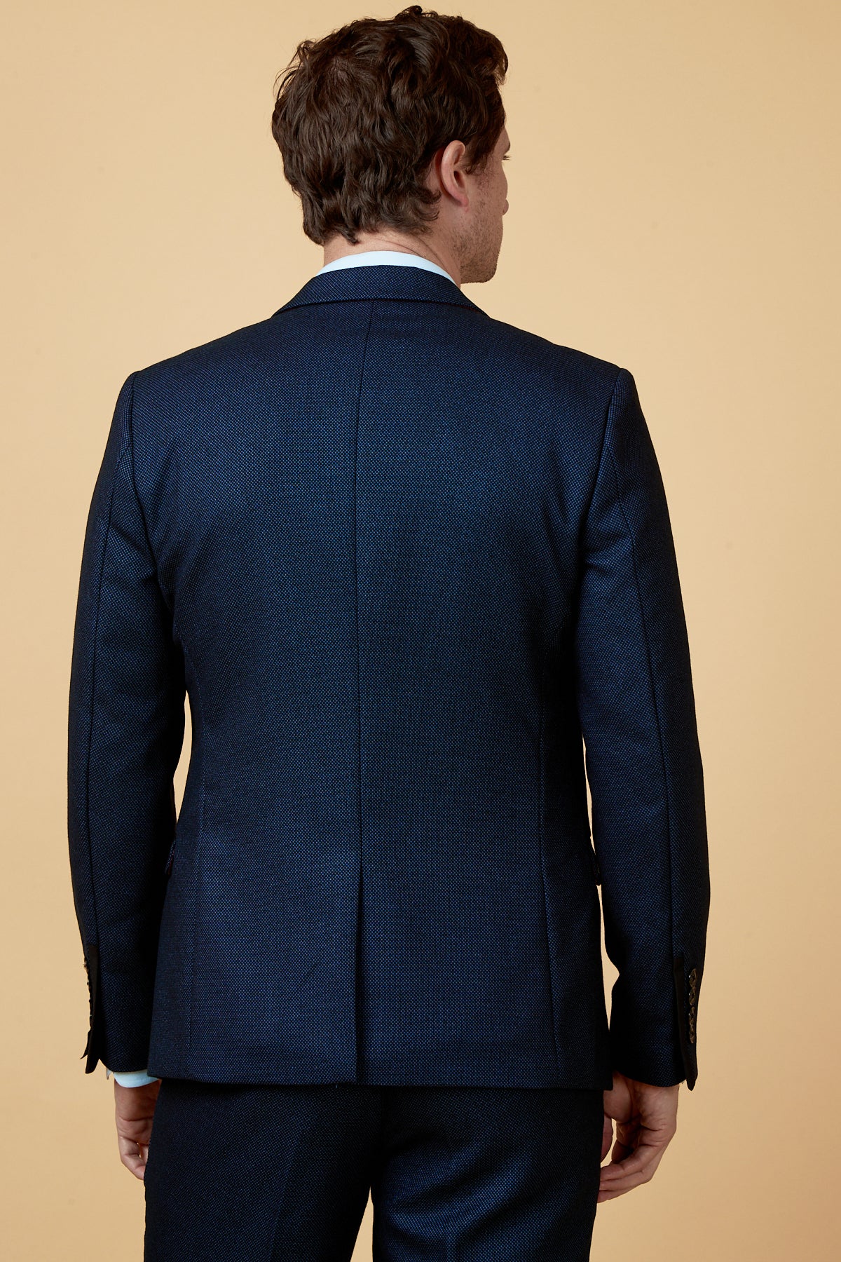 Back view of a man wearing the marcdarcy CALLUM Blue Blazer with matching pants, ideal for formal occasions.