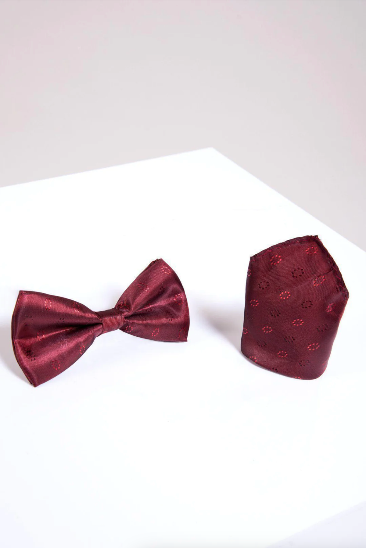 The Accessory BT CIRCLES set features a wine circle print bow tie and matching pocket square, displayed on a white surface with a light gray background.