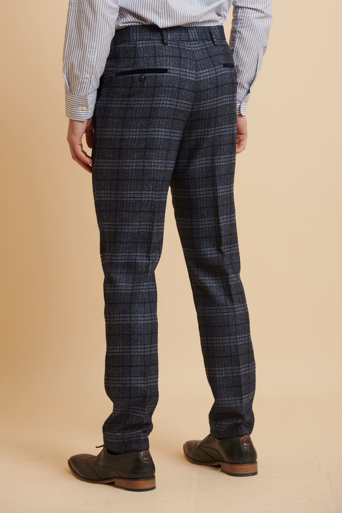 Man wearing Marc Darcy ANDY blue check trousers and a striped shirt.