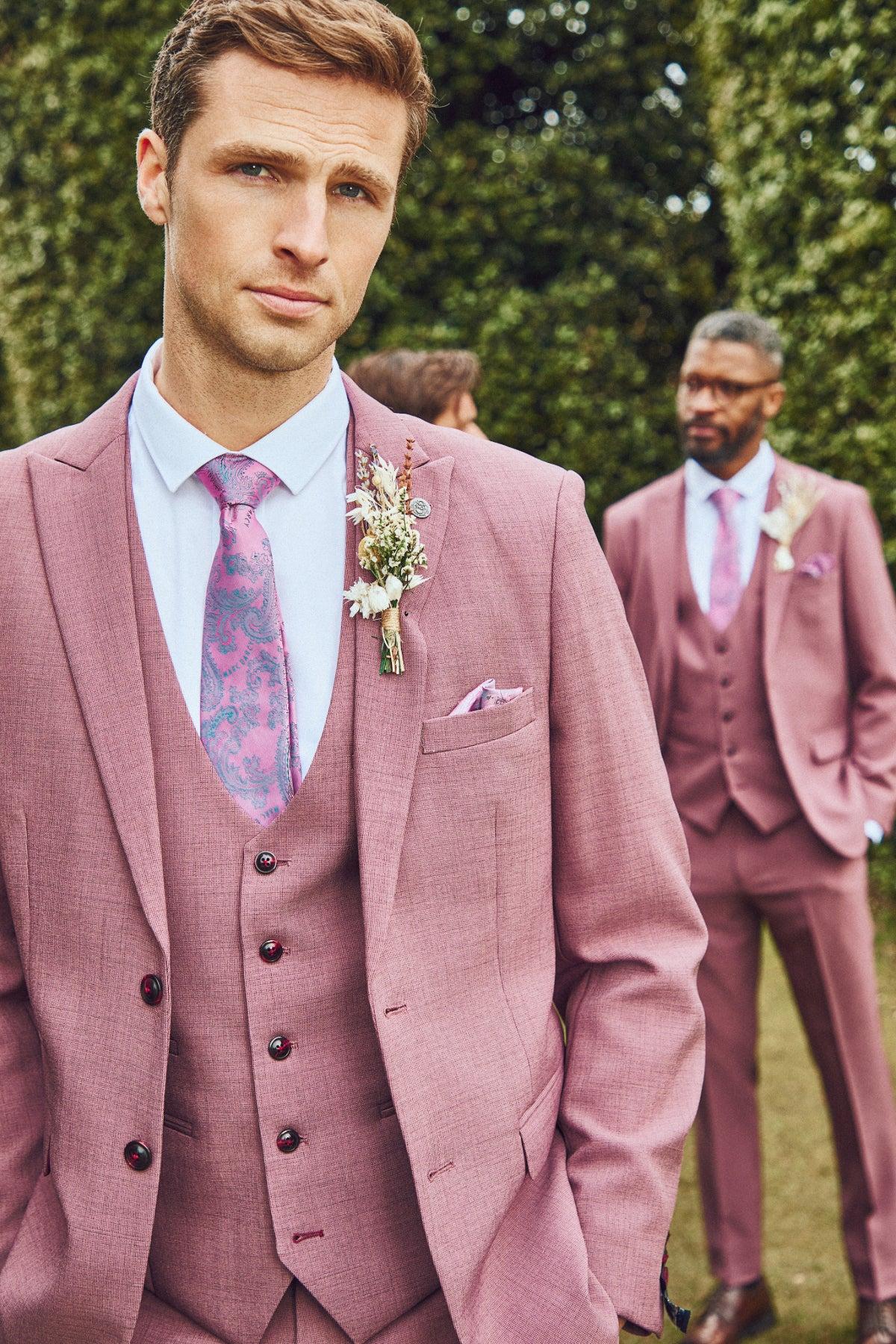 Men wear the Marc Darcy MONTY Mauve Three Piece Suit with white shirts and patterned ties, finished with boutonnières—a stylish summer wedding choice.