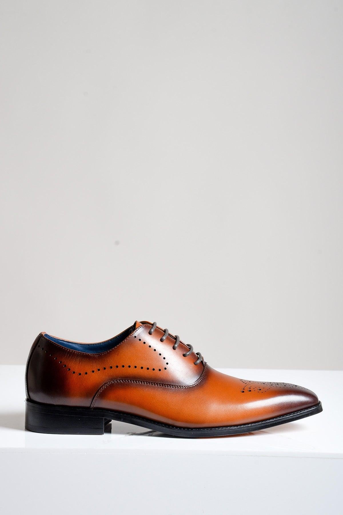 The JAKE Tan Leather Contrast Oxford Shoe by Marc Darcy features decorative perforations, black laces, and a low black heel—ideal for formal or business wear, displayed against a plain light background.