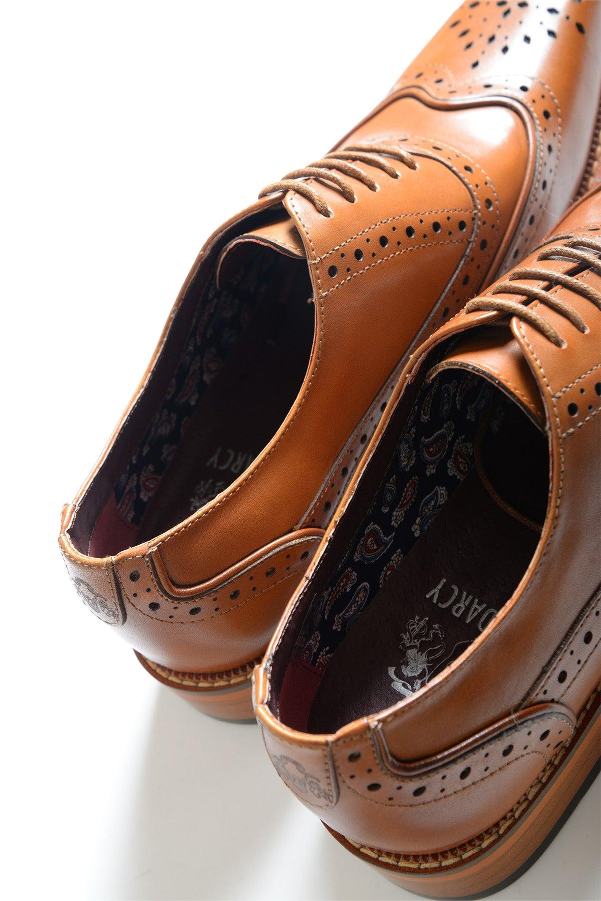 The Marc Darcy LARKIN - Tan Leather Brogue Shoes feature decorative perforations, hand-stitched details, and patterned insoles, shown side by side on a white background.
