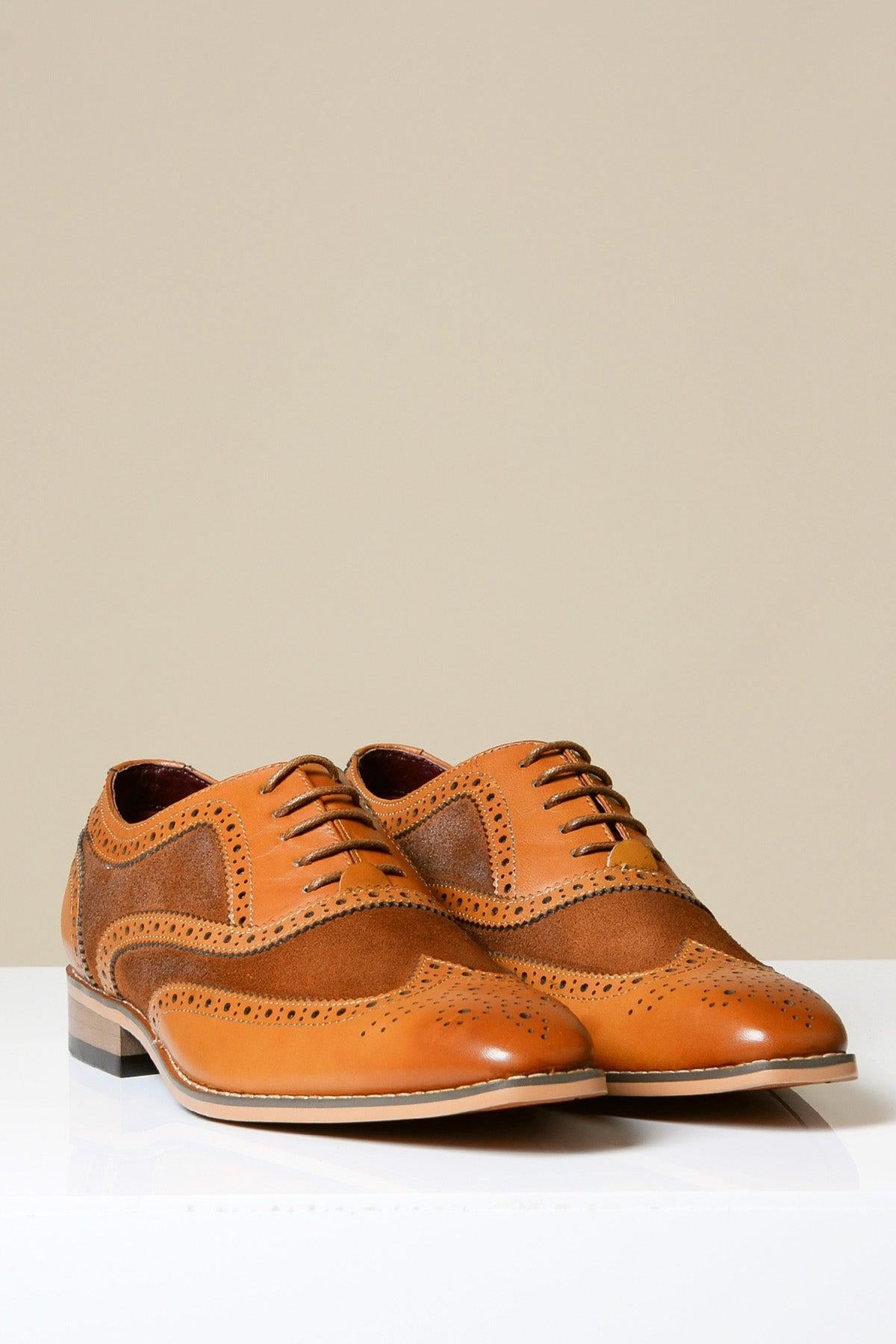 The BRADLEY Tan Leather Suede Contrast Brogue Shoe by Marc Darcy features brogue detailing and perforations in full grain leather, displayed on a white surface with a beige background.