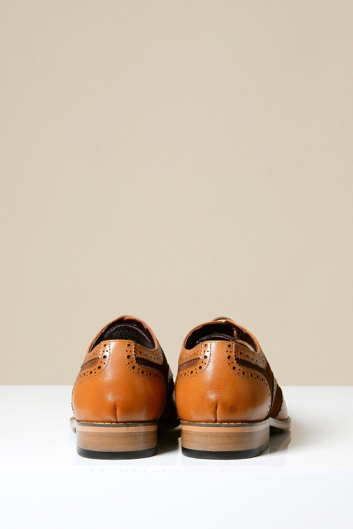 Rear view of Marc Darcy's BRADLEY Tan Leather Suede Contrast Brogue Shoes for men, crafted from full grain leather with brogue detailing and dark brown suede accents, displayed on a white surface against a neutral background.
