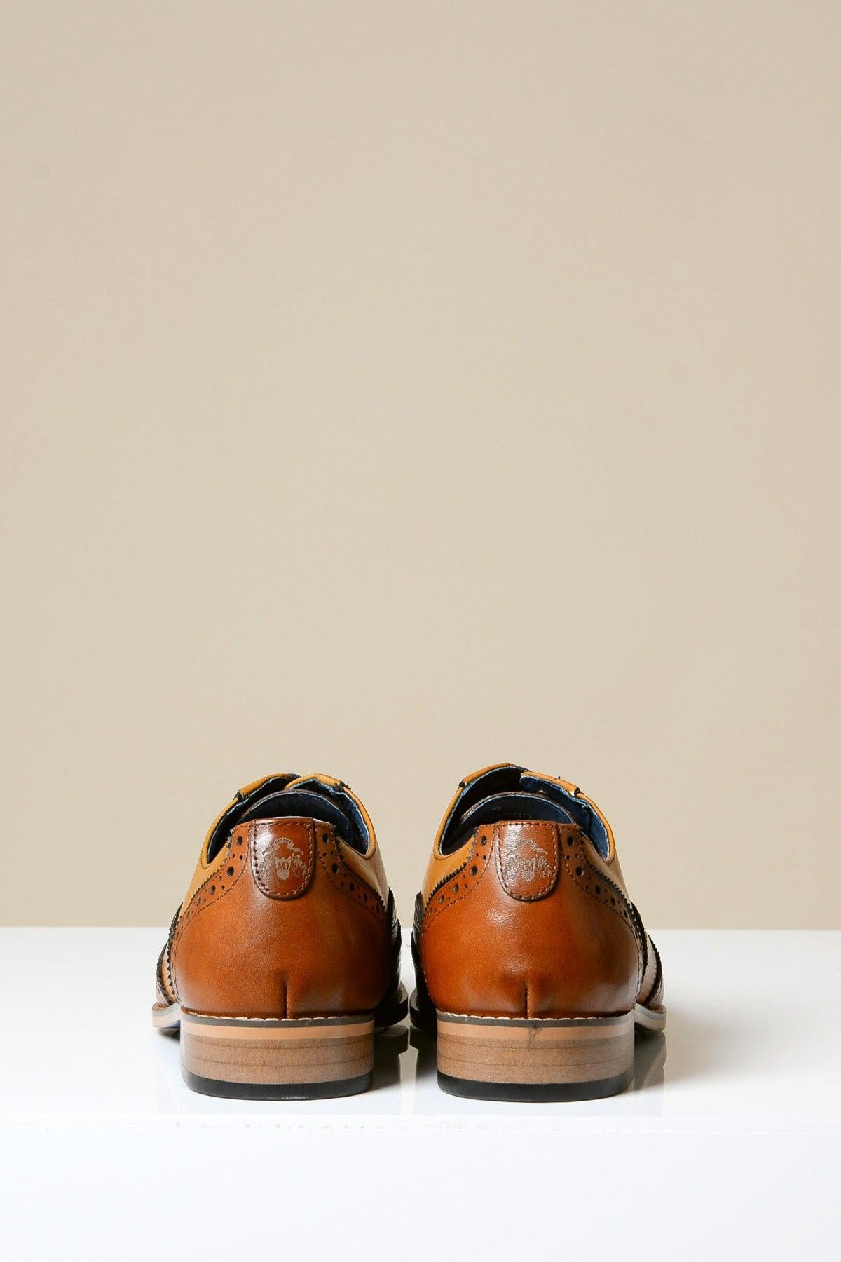 The MARCO - Tan Leather Oxford Wingtip Shoes by Marc Darcy are shown side by side from the back, highlighting their classic broguing on a white surface with a plain beige background.