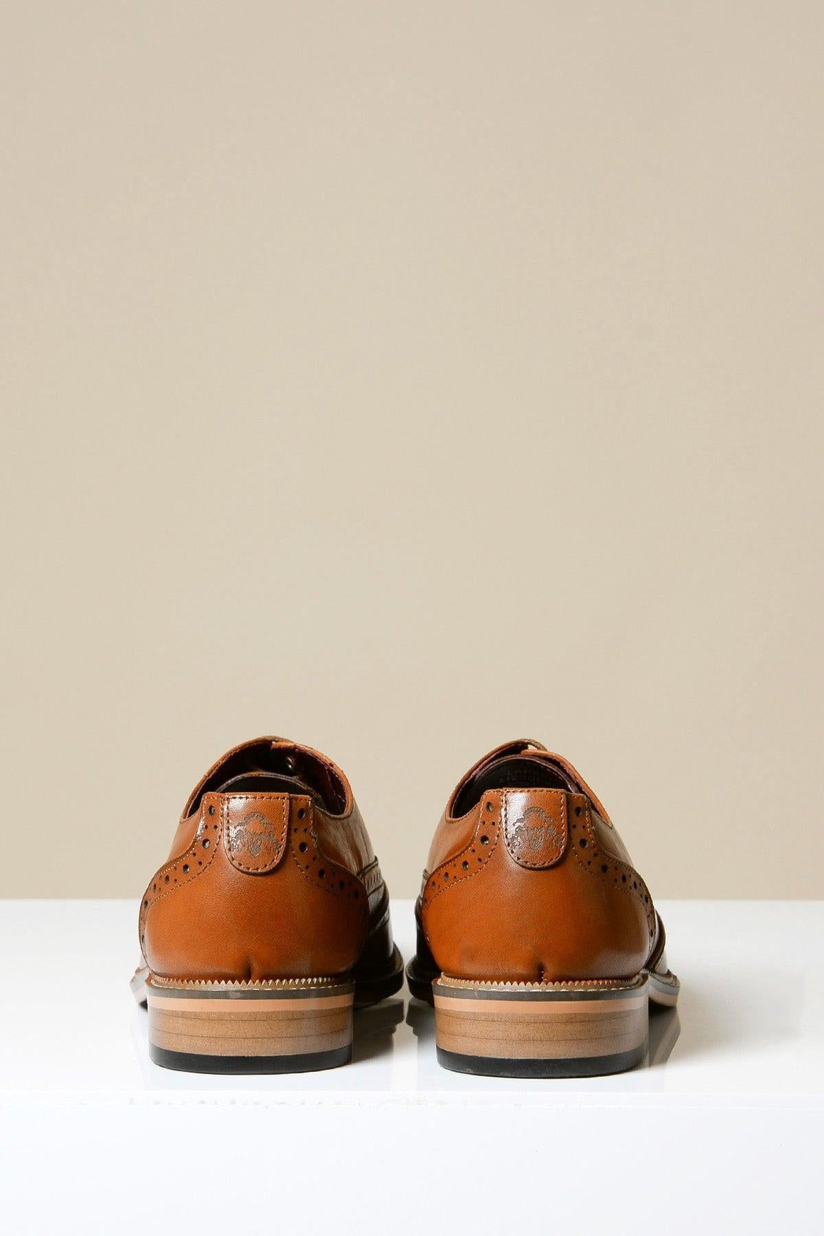 The Marc Darcy LARKIN Tan Leather Brogue Shoes are displayed from the back on a white surface with a neutral background.