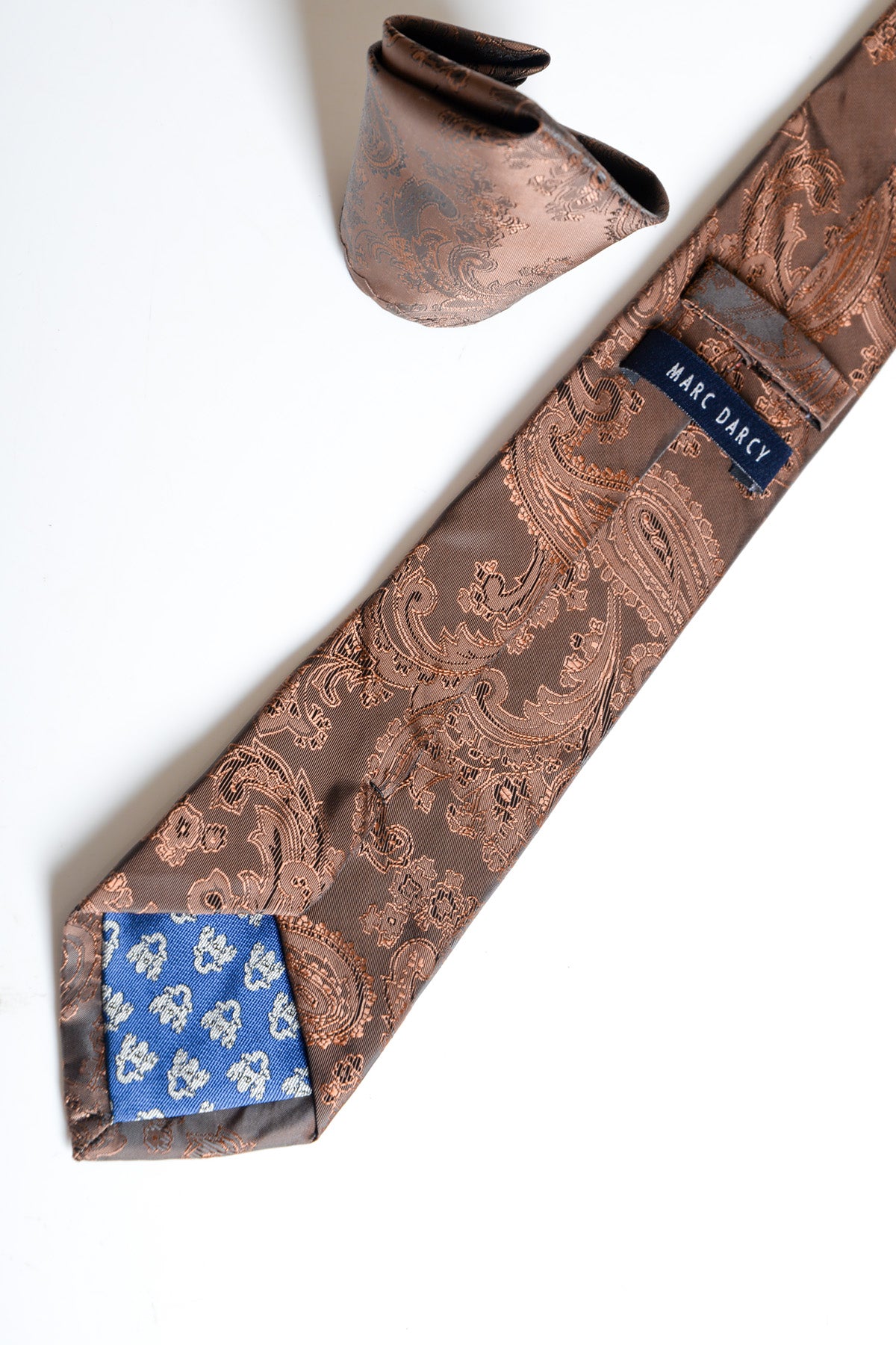 The Accessory MD PAISLEY Brown Paisley Tie and Pocket Square Set is shown on a white background, featuring a brown paisley print and branded with the Accessory label.