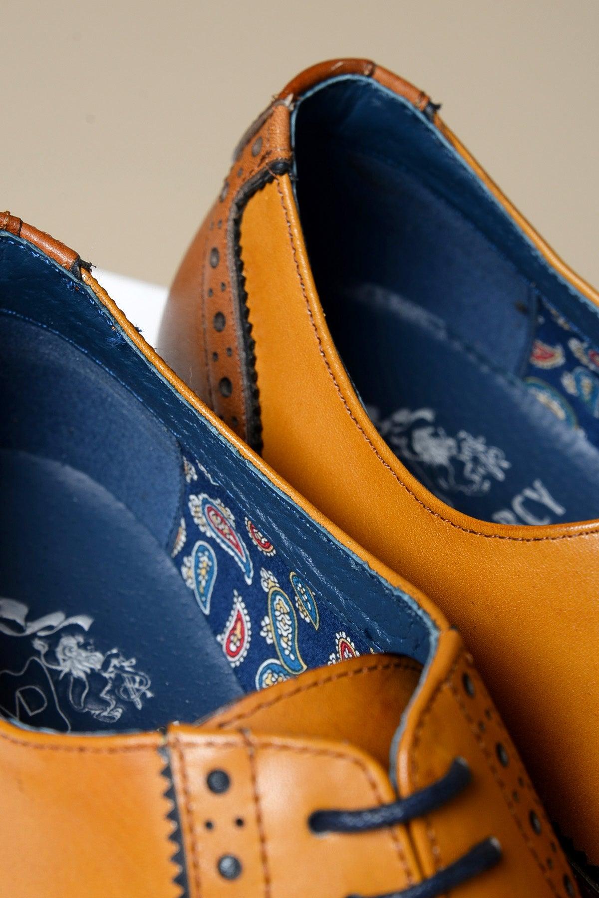 Close-up of Marc Darcy's MARCO Tan Leather Oxford Wingtip Shoe, crafted from hand-stitched full grain leather with blue paisley lining and navy laces.