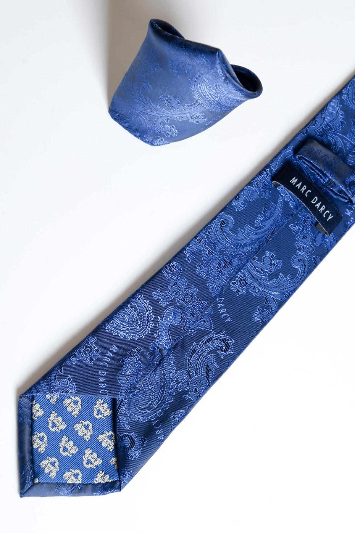 The MD PAISLEY - Midnight Navy Paisley Tie and Pocket Square Set by Accessory, essential men's accessories, is displayed on a white surface with the necktie showing a visible brand label on the back.