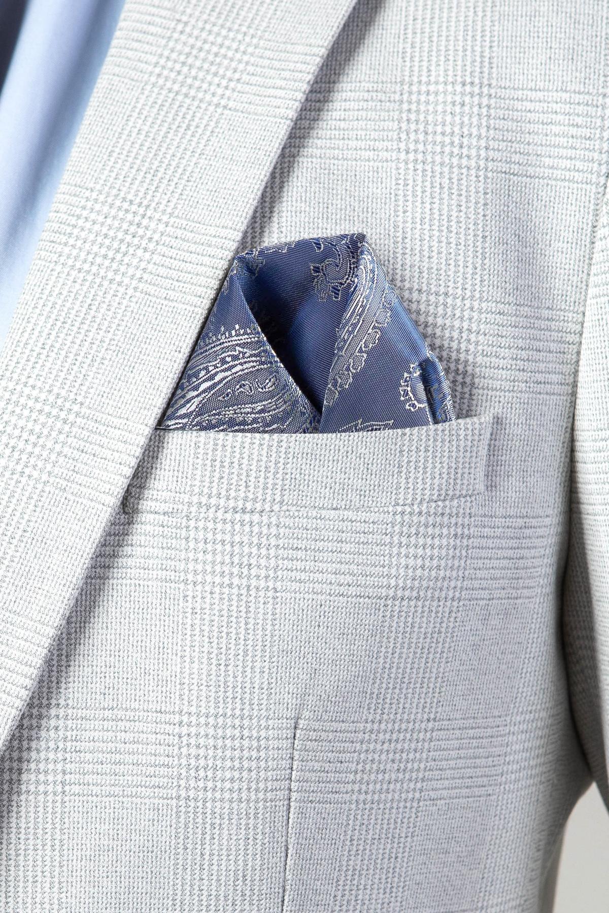 The WBA Collection - BROMLEY Stone Suit jacket by Marc Darcy in light gray Prince of Wales check, styled with a blue paisley pocket square.