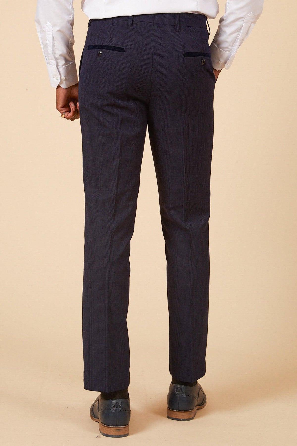 Back view of a man in the Marc Darcy West Ham United Footballer Jarrod Bowen in Bromley Navy Check Suit, paired with a white shirt and dark shoes.