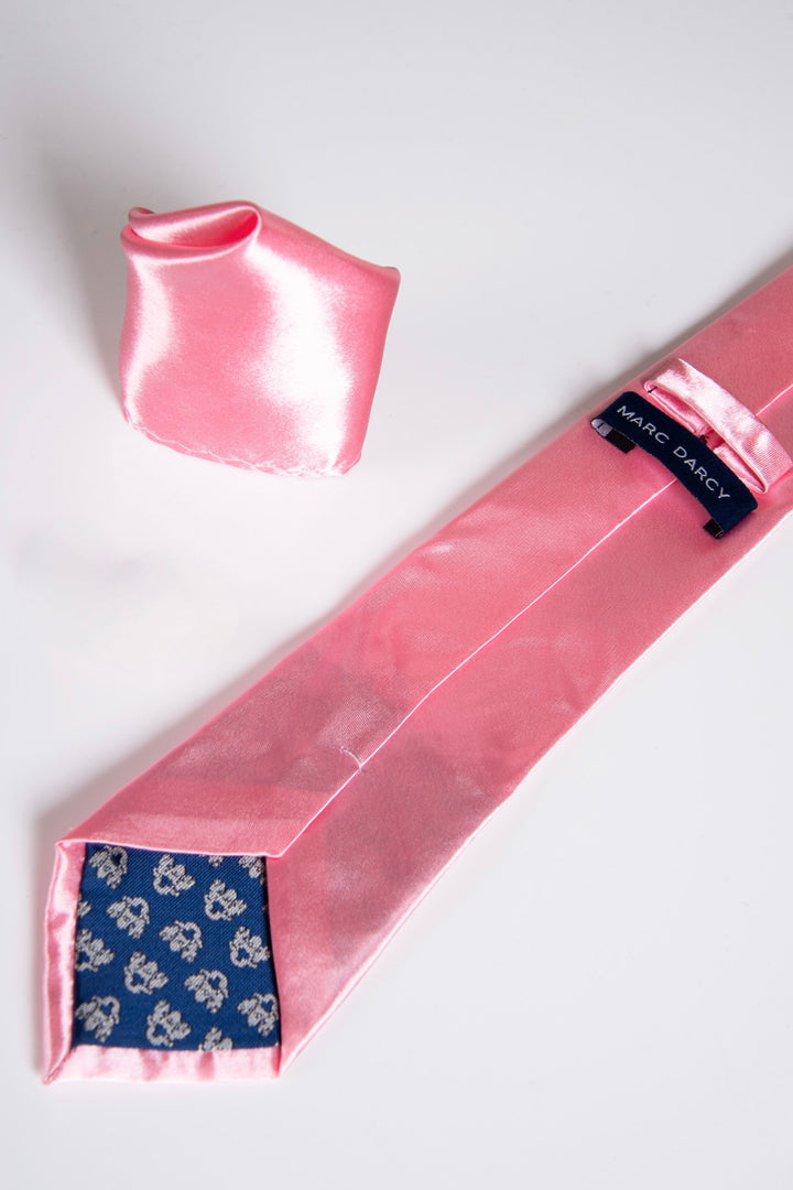 The Accessory ST - Satin Tie and Pocket Square Set in Blush Pink features a shiny blush pink tie with a blue floral-patterned tip and Marc Darcy label, plus a matching pocket square, all displayed on a white surface.