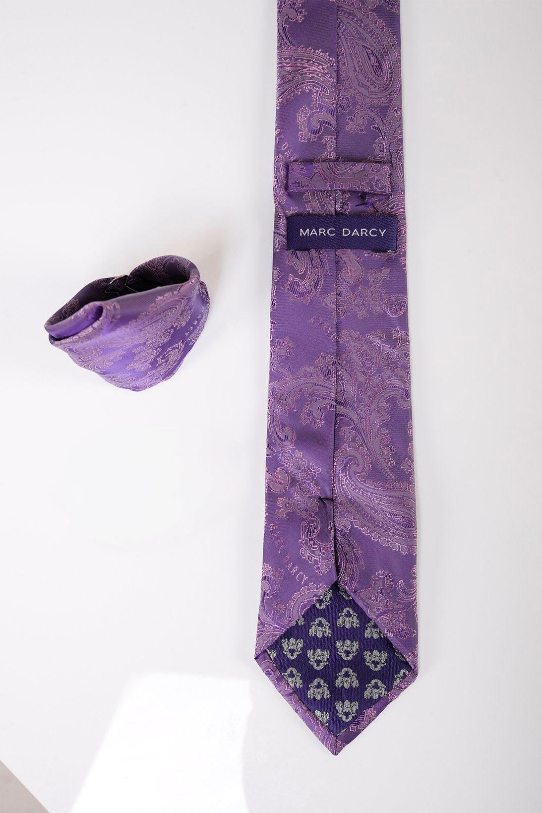 The PAISLEY - Purple Paisley Tie and Pocket Square Set by Accessory is displayed on a white surface, featuring a stylish paisley pattern—ideal for formal looks.